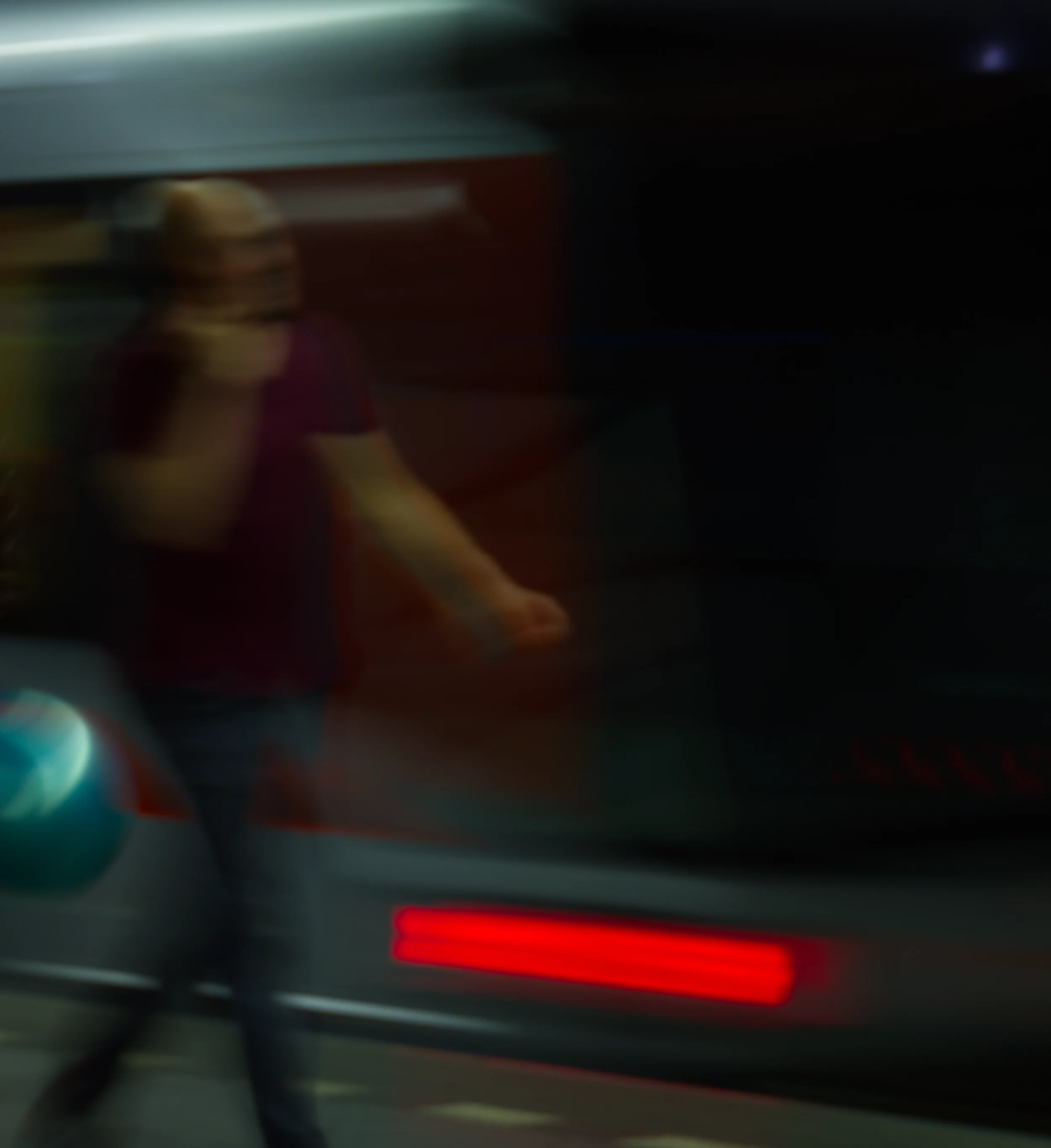 A person walking past a subway.