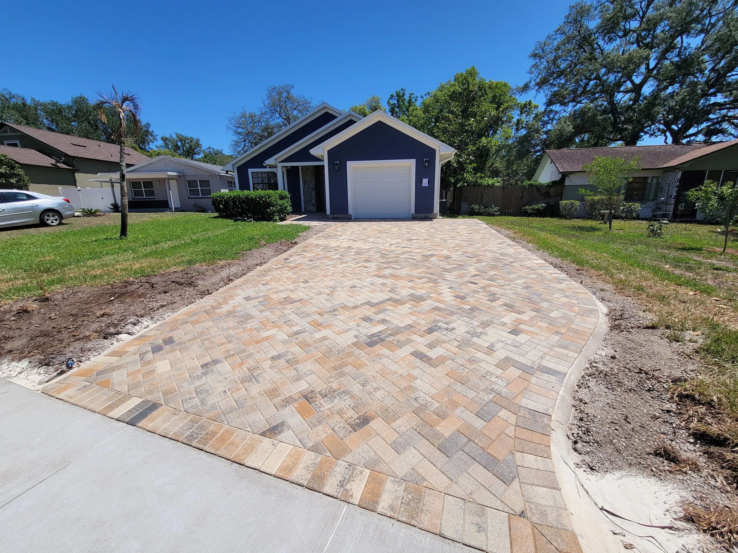 Sealed brick paver driveway with wet look finish in Tampa Bay FL — Xcel paver sealing Pasco Pinellas Hernando County