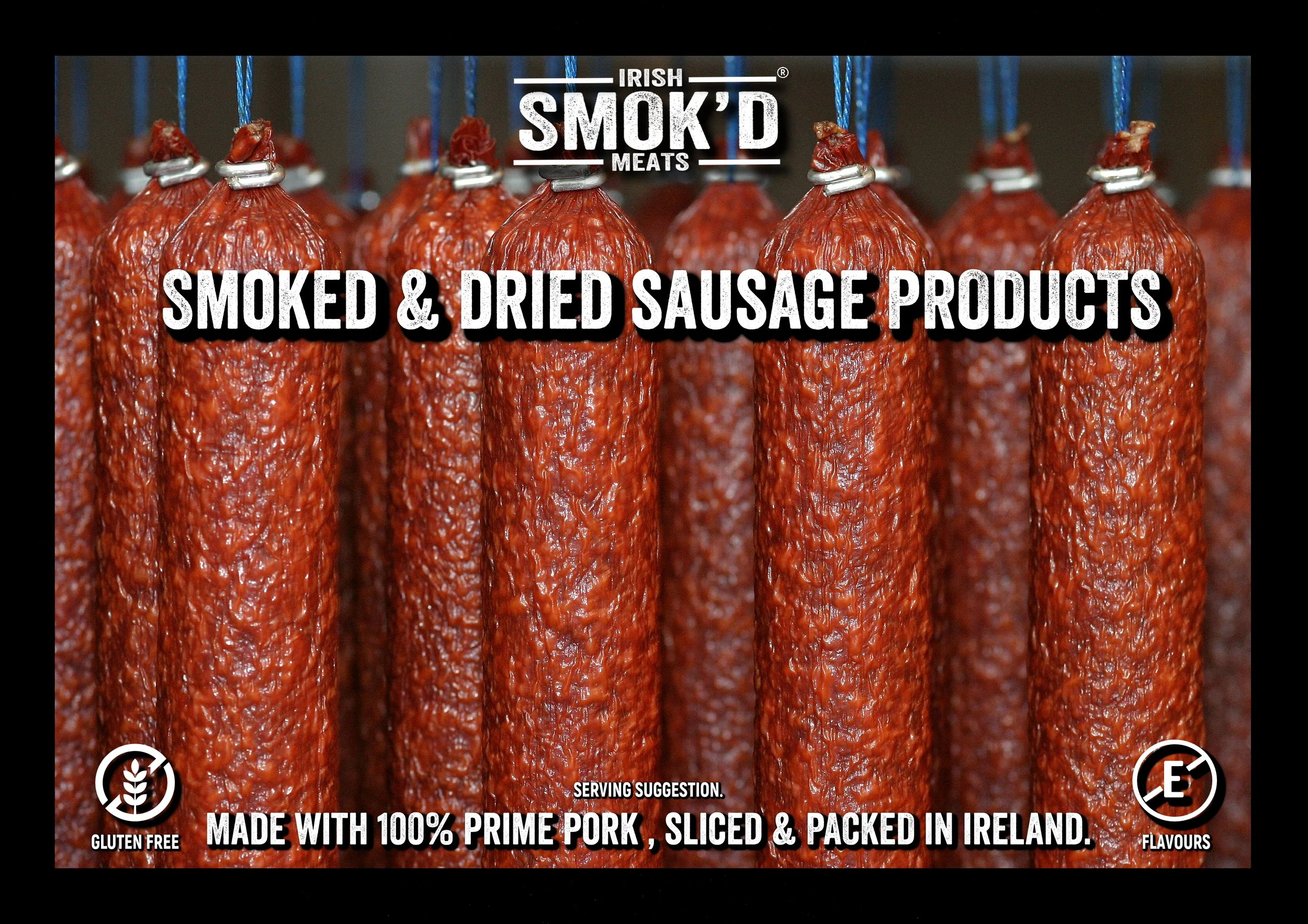 Close-up of smoked and dried sausage products hanging on hooks in a meatery, with text overlay advertising Irish Smokin' Beads meats, gluten-free, made with 100% prime pork, sliced, packed in Ireland.