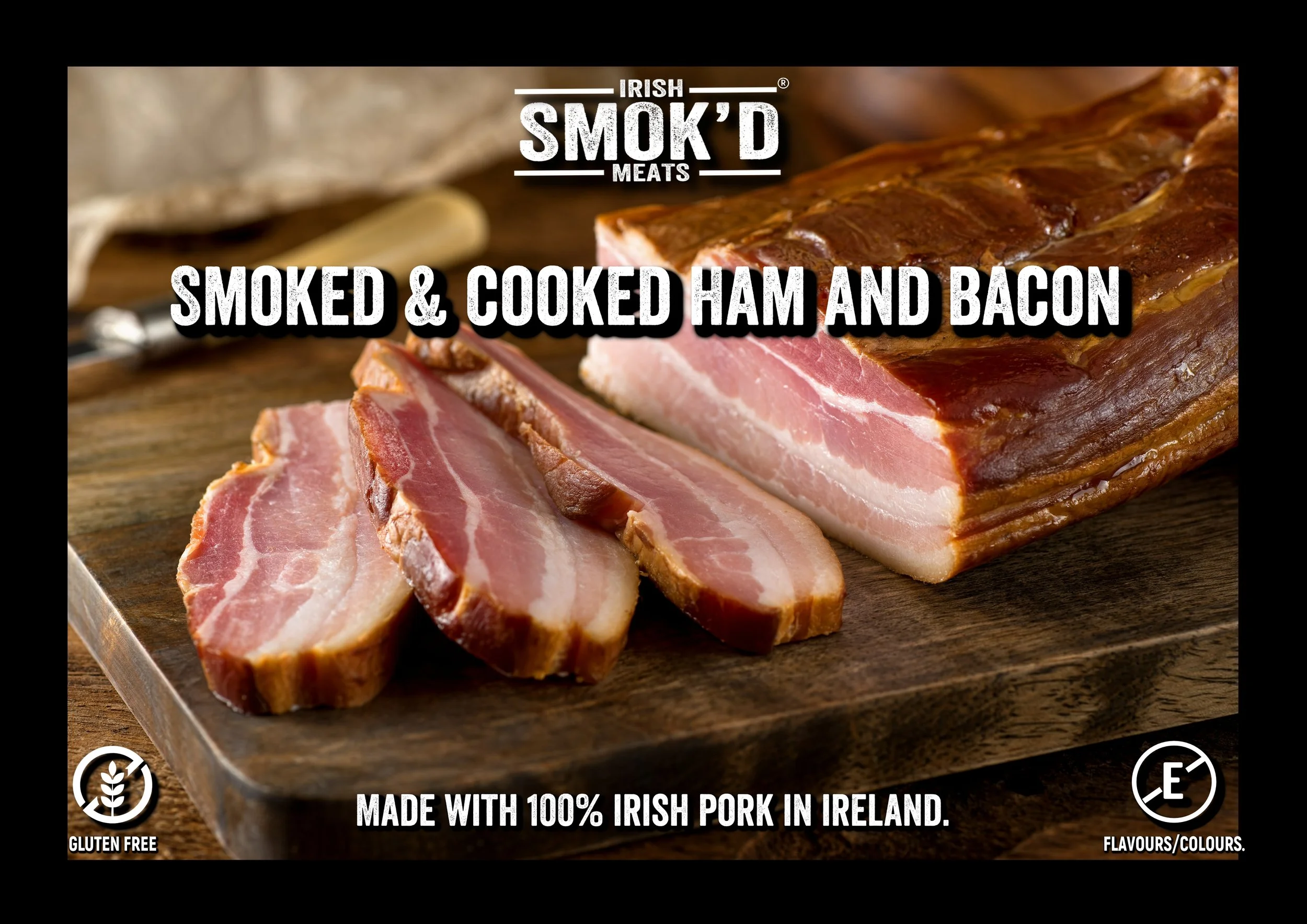 Sliced smoked and cooked ham and bacon on a wooden cutting board, with text indicating Irish smoked meats made with 100% Irish pork in Ireland, gluten free, and flavor/colors.
