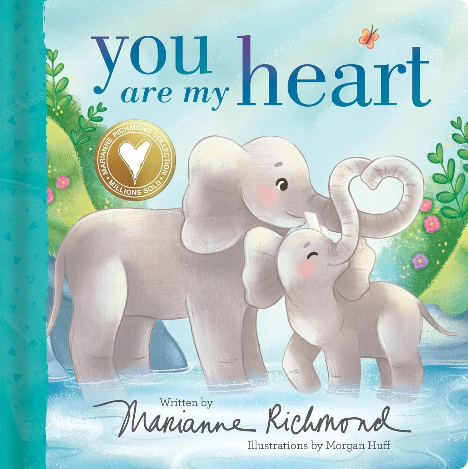 Cover of a children's book titled "You Are My Heart" featuring two cartoon elephants, one larger and one smaller, in a pond with a blue background and greenery.