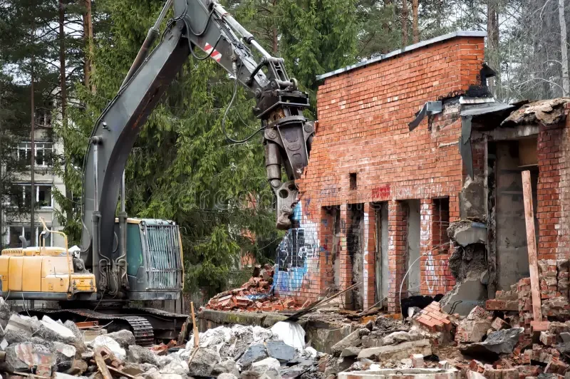heavy-machinery-demolishes-red-brick-building-forest-background-visaginas-city-lithuania-142301843.webp