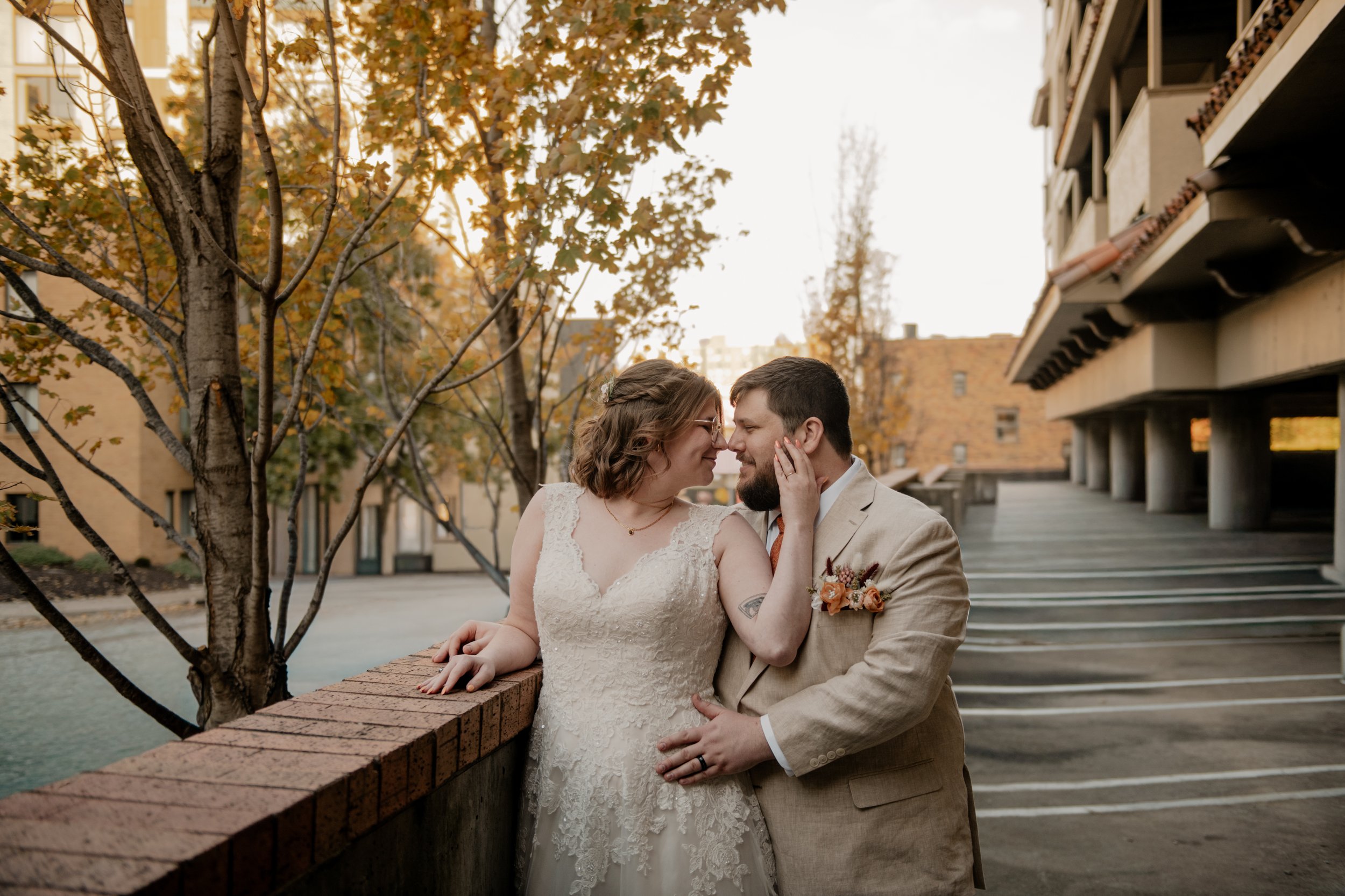 Newlyweds posing for portraits at the Country Club Plaza