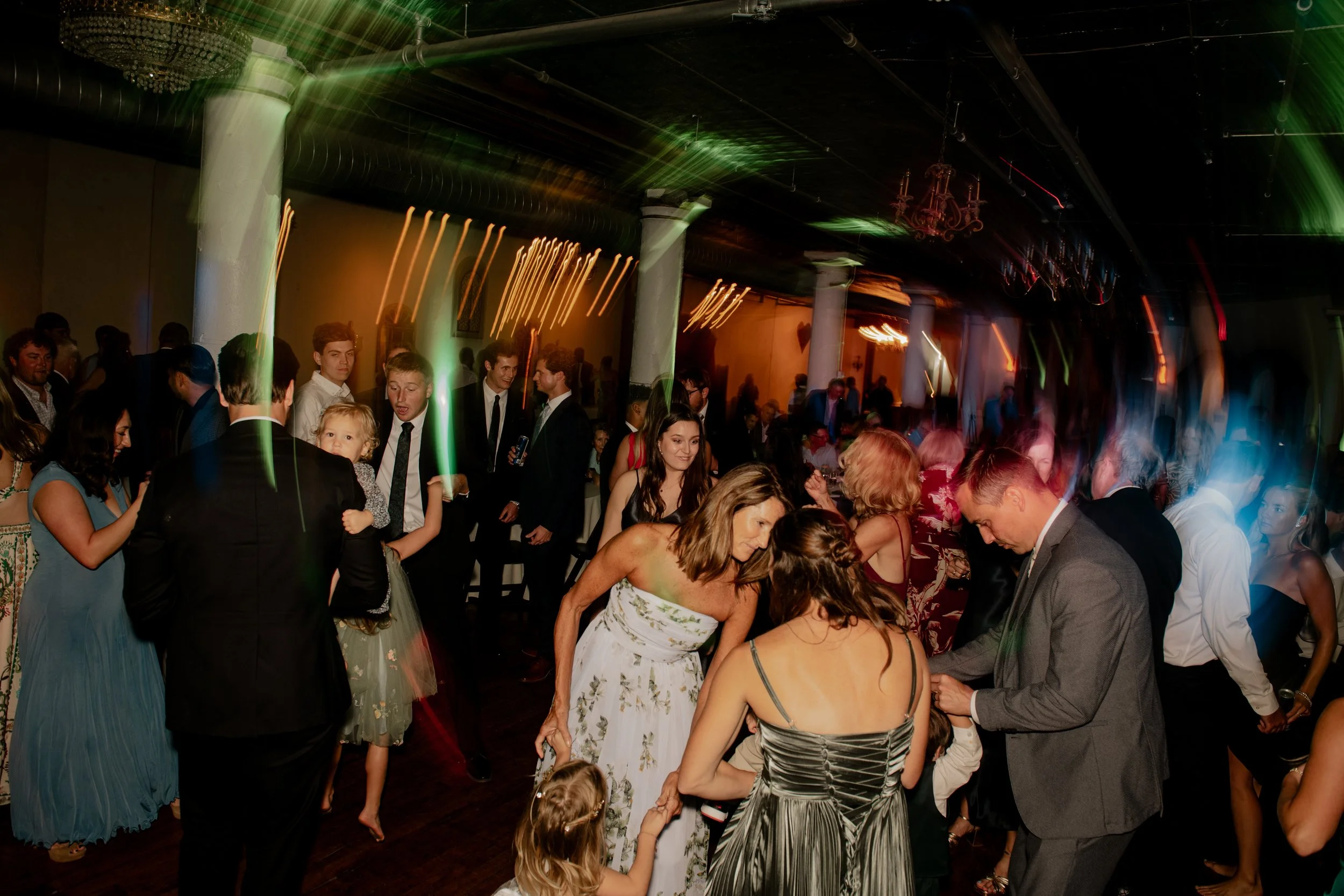 Guests dancing during a wedding reception held at The Rumley