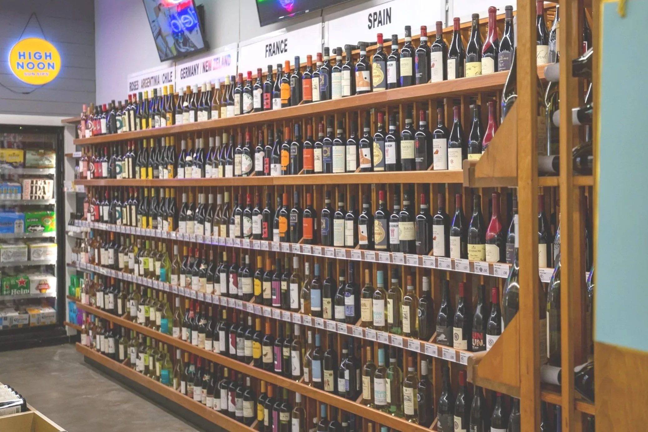 Interior photo of Bin 14, highlighting a shelf of wines.