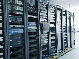 Server racks in a data center with computer equipment and cabling.