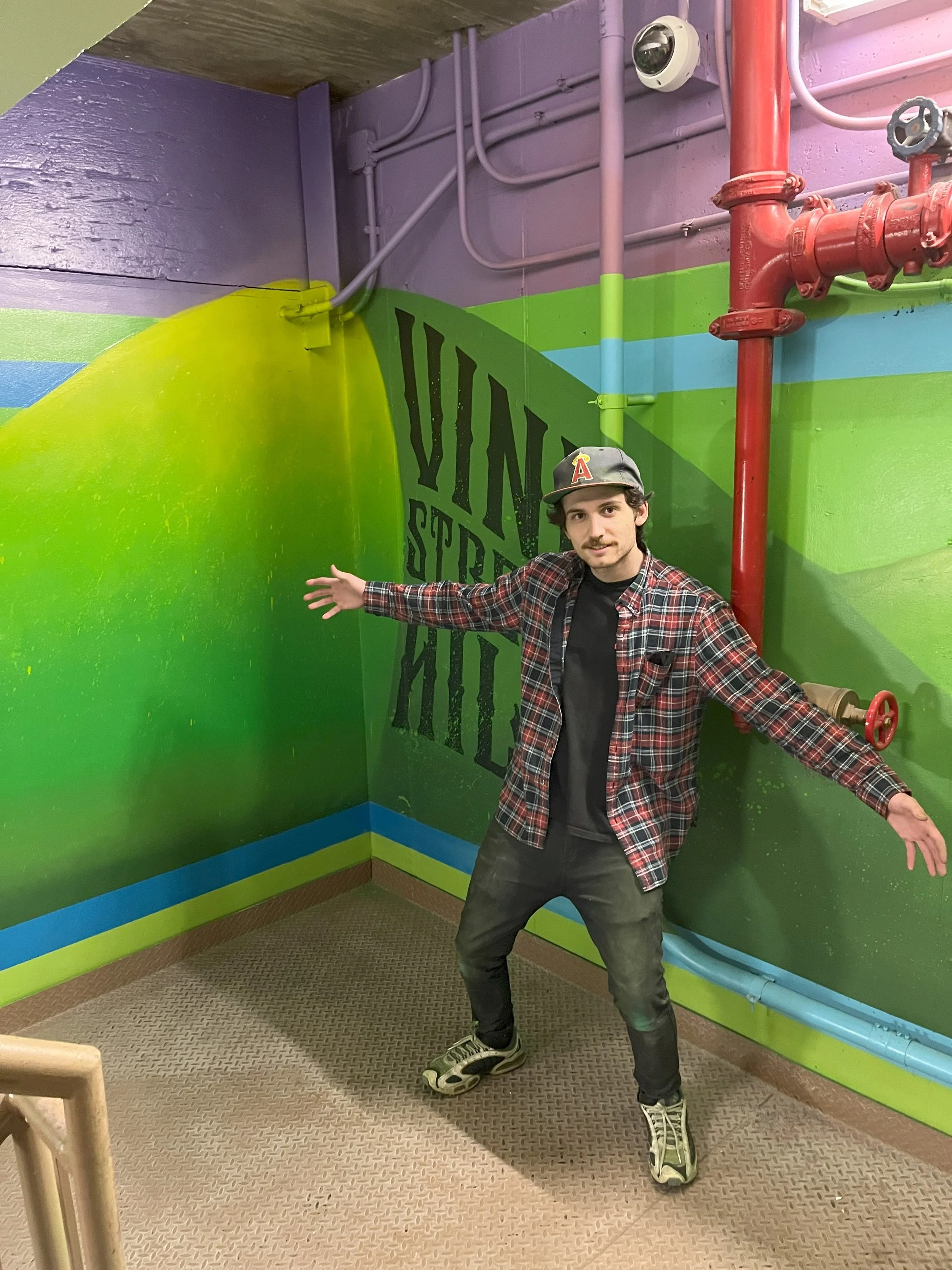 Deloitte Cincinnati multi-floor stairwell mural with James AKA GLOSSBLACK