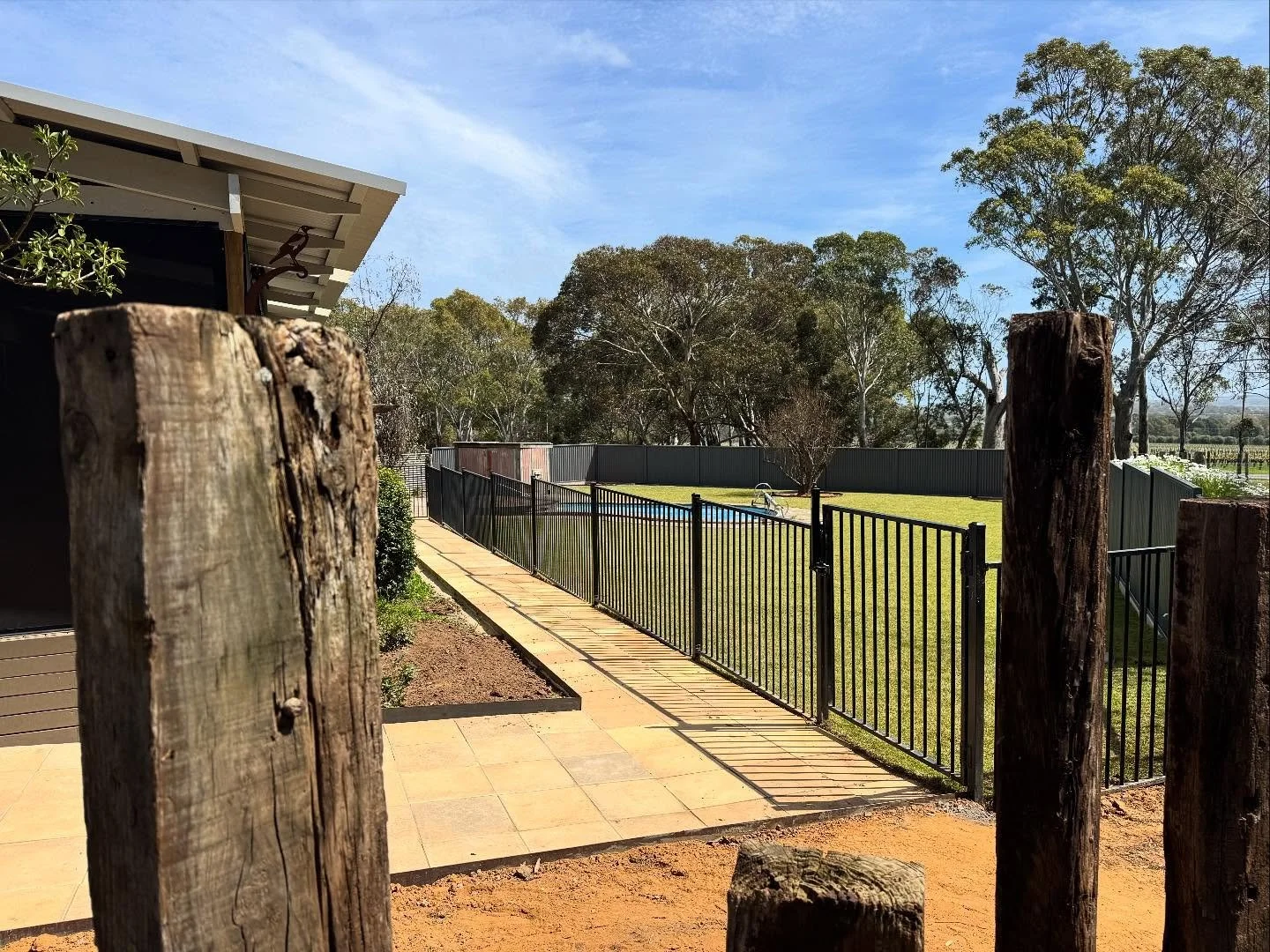 Bit of everything on this one

- Paving using recycled pavers.
- Steel edging.
- Fencing and retaining.
- Extending the crazy pave with recycled slate.
- Feature railway sleepers.
- Irrigation and lawn.

A beautiful property now ready to be enjoyed i
