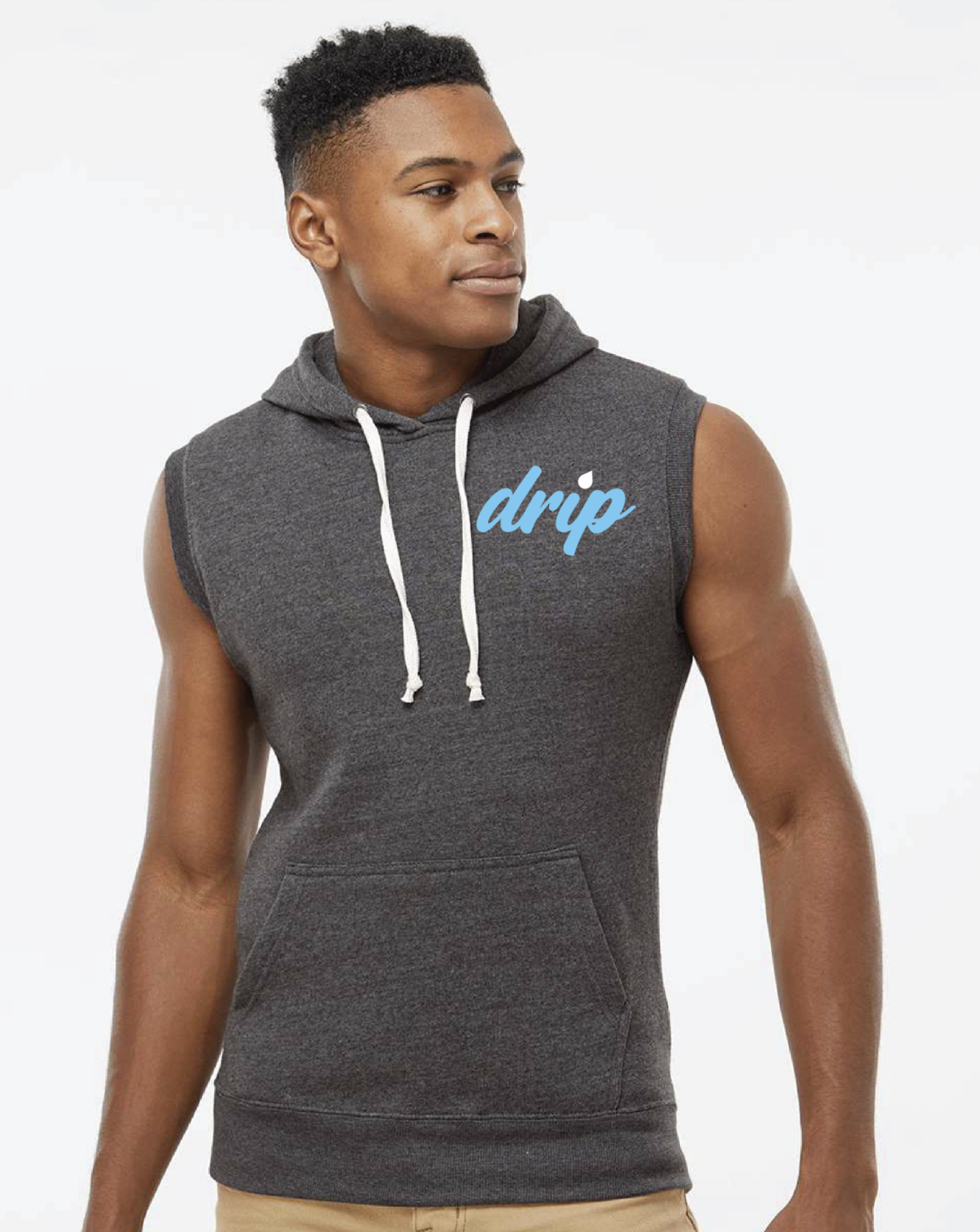 A young man with short curly hair wearing a sleeveless dark gray hoodie with a front pocket and white drawstrings, standing against a plain white background, with the word 'drip' written in blue cursive on his chest.