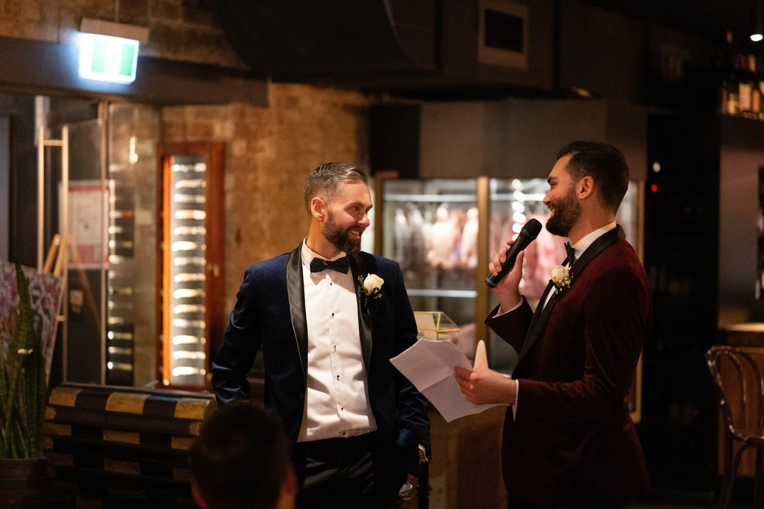 Grooms reading out their wedding speech.