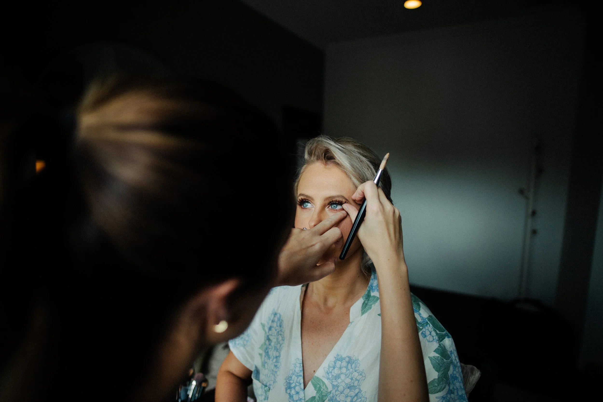 Bride getting her hair and makeup done.