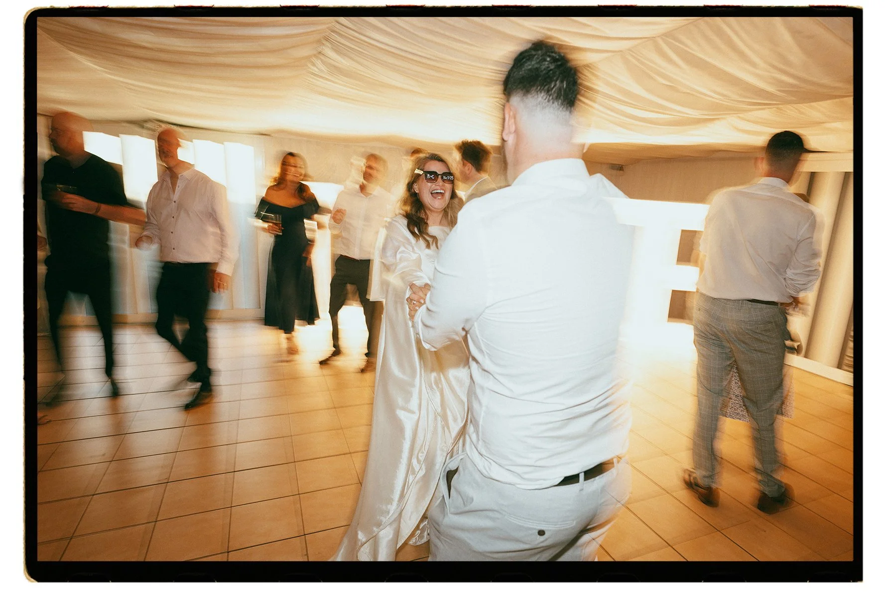 Film + Digital Wedding Photographer Christchurch - Kaiapoi Wedding, Canterbury, New Zealand. Fun candid photo of bride and groom dancing at wedding reception.