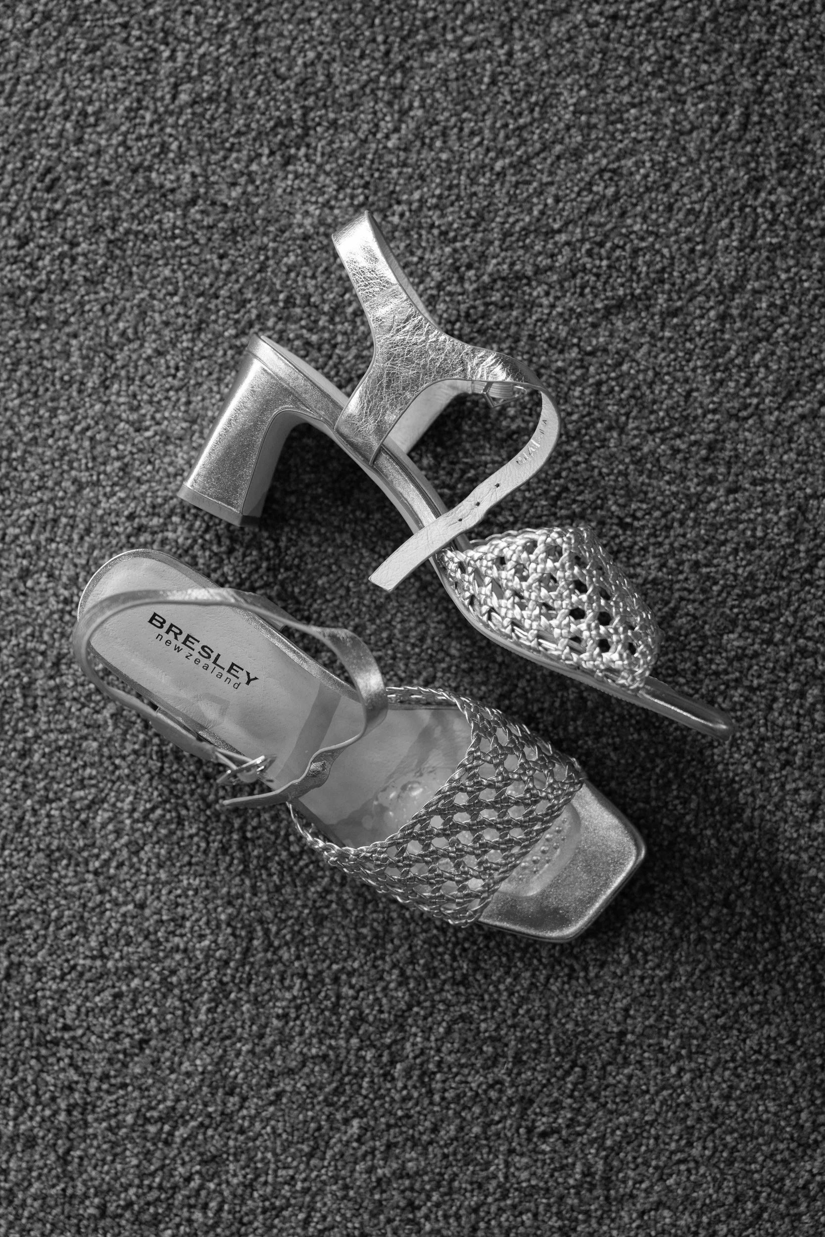 Film + Digital Wedding Photographer Christchurch - Backyard Wedding, Christchurch, Canterbury, New Zealand. A pair of golden high-heeled shoes.