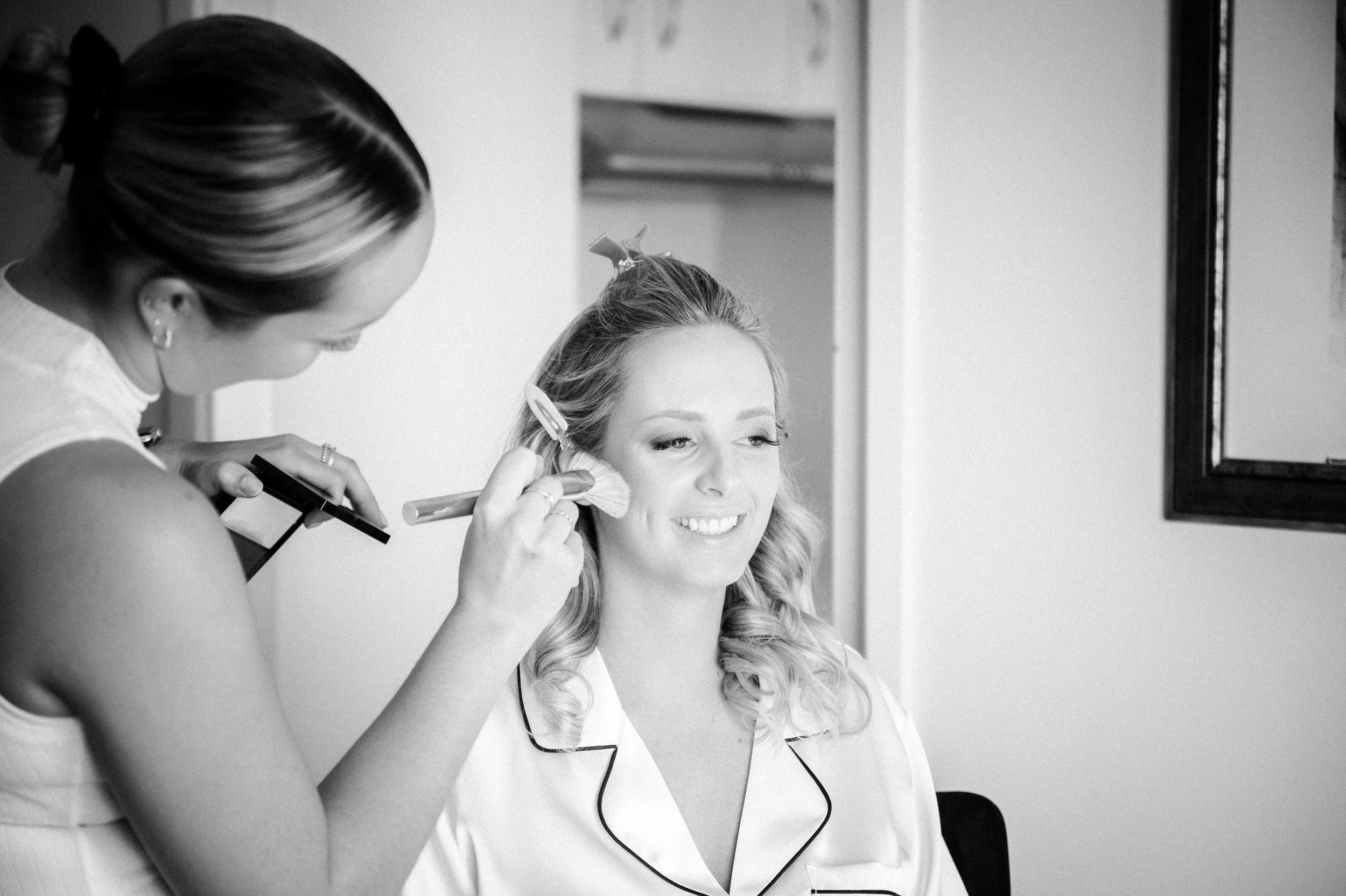 Bride getting her hair and makeup done.