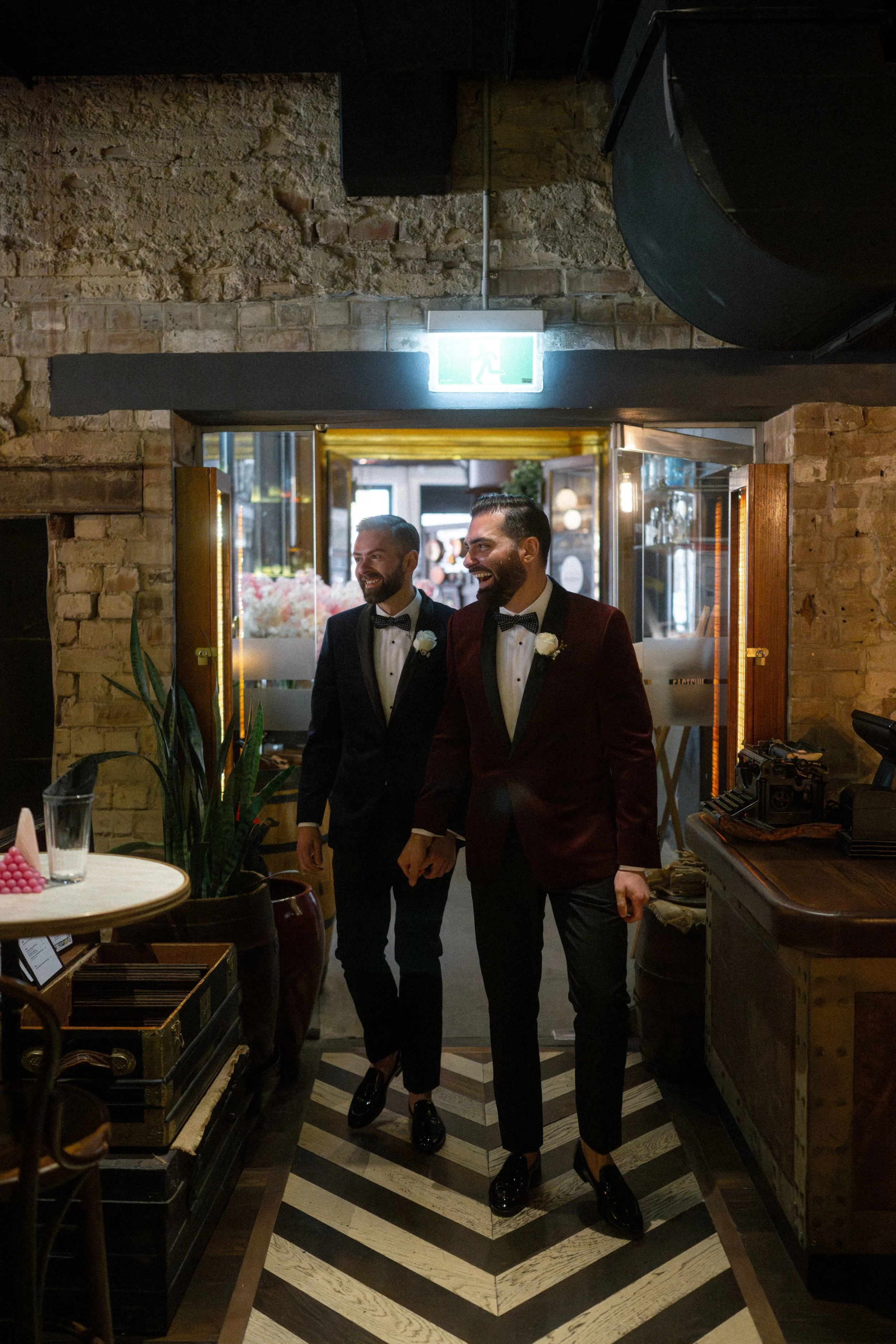 Wedding couple entering the venue together.
