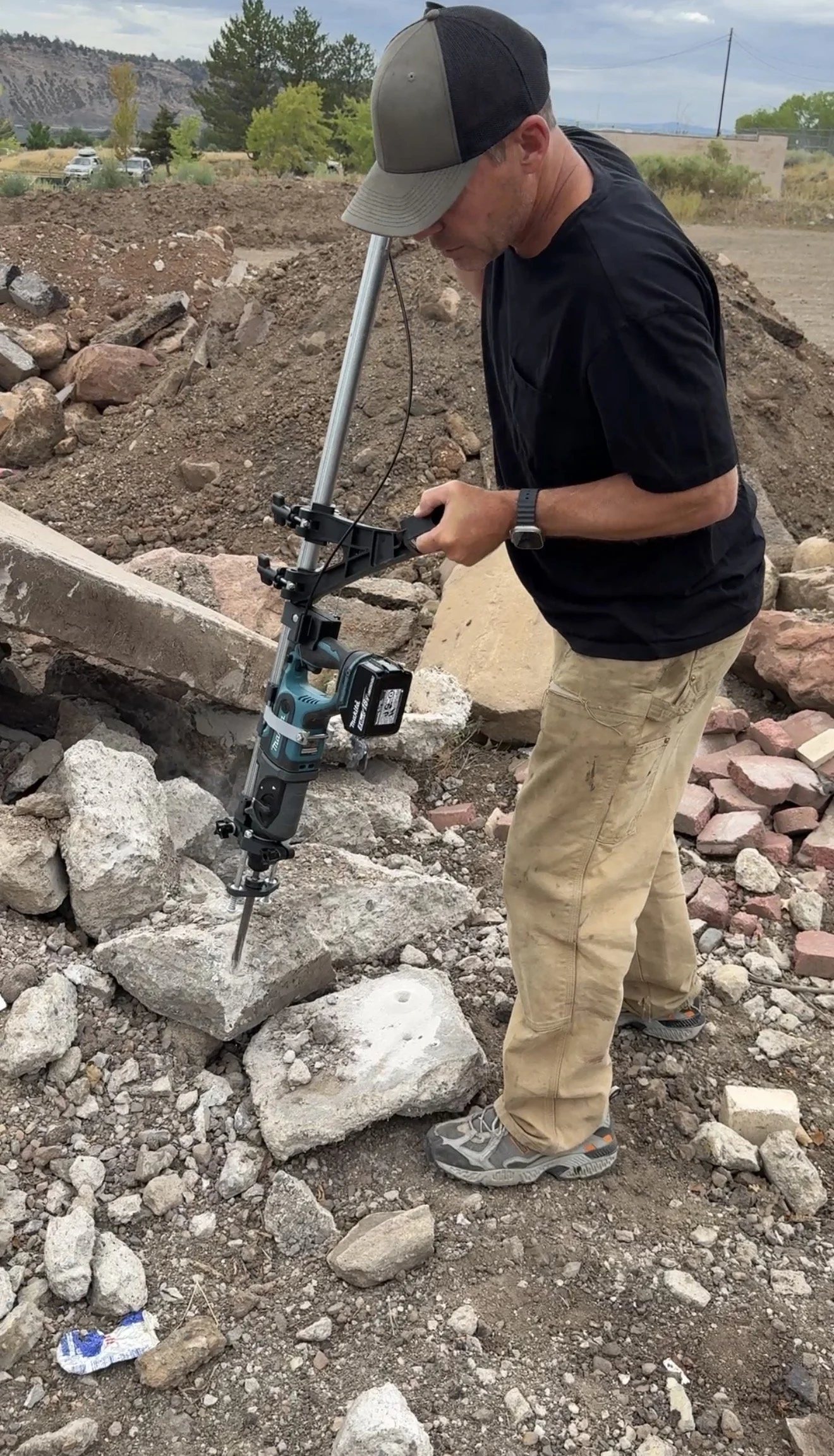 Demolition stick busting concrete