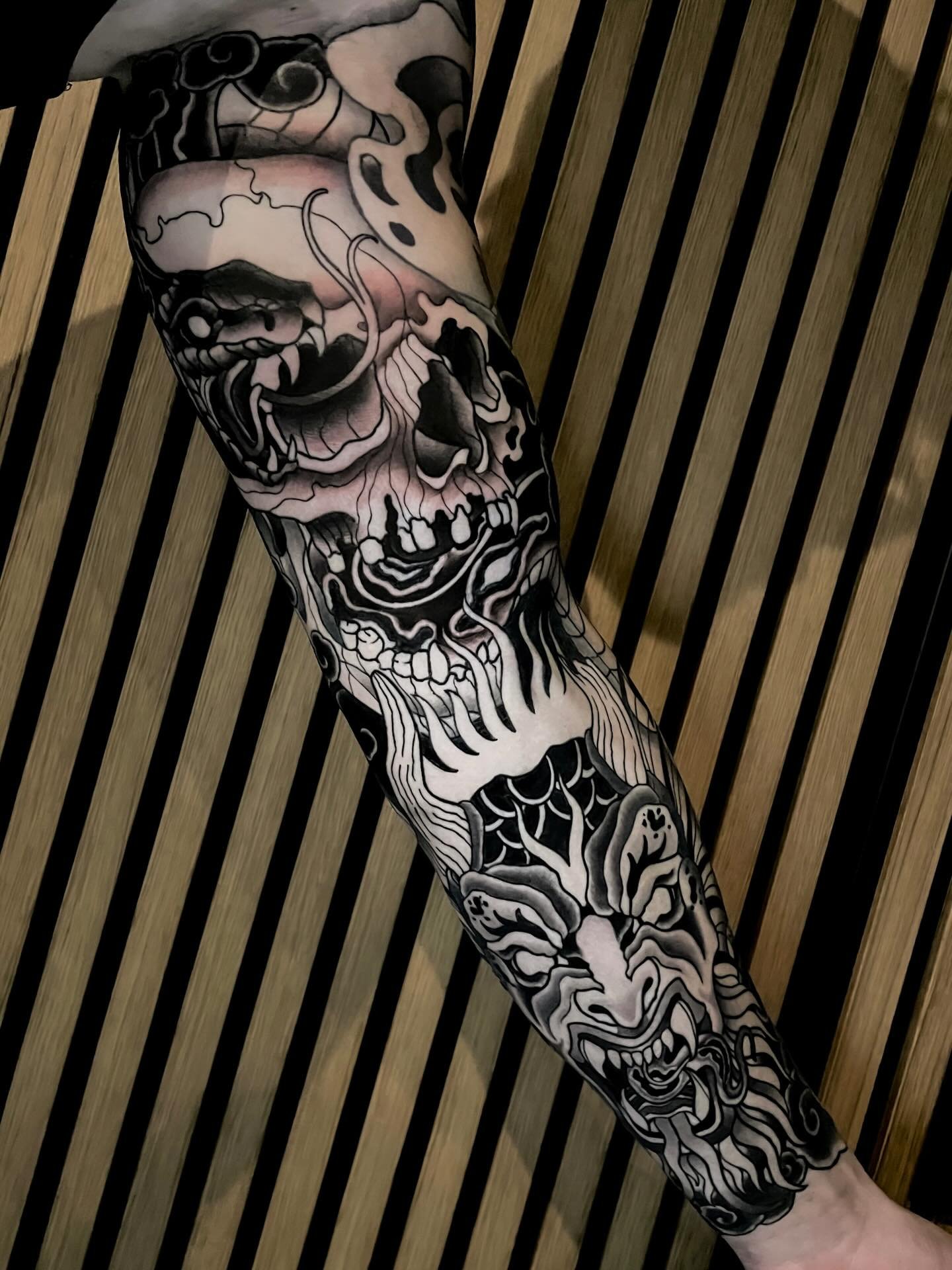 &bull; SKULL&amp;DEMON &bull; started this awesome piece at @brusselstattooconvention on the amazing @carlos.garx 🫶🏼 Swipe for fresh shading on the skull and snake (lines healed) and healed demon 🔥this project was so cool and i would love to do mo