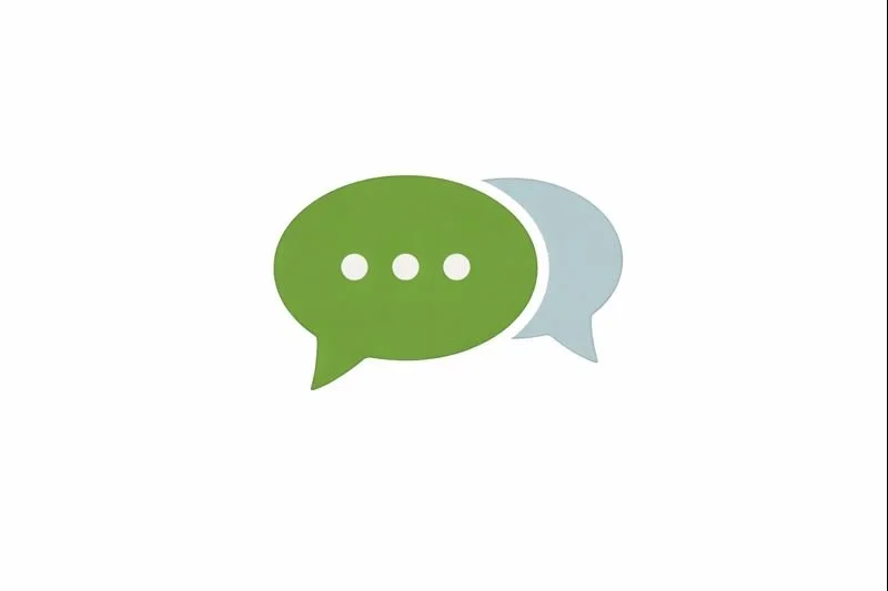 Green speech bubble with three white dots, overlapping a smaller gray speech bubble with three gray dots, representing communication or messaging.