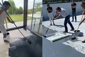 Cuatro personas trabajando en la limpieza y el acabado de una plataforma de concreto en un espacio abierto con vista al agua.