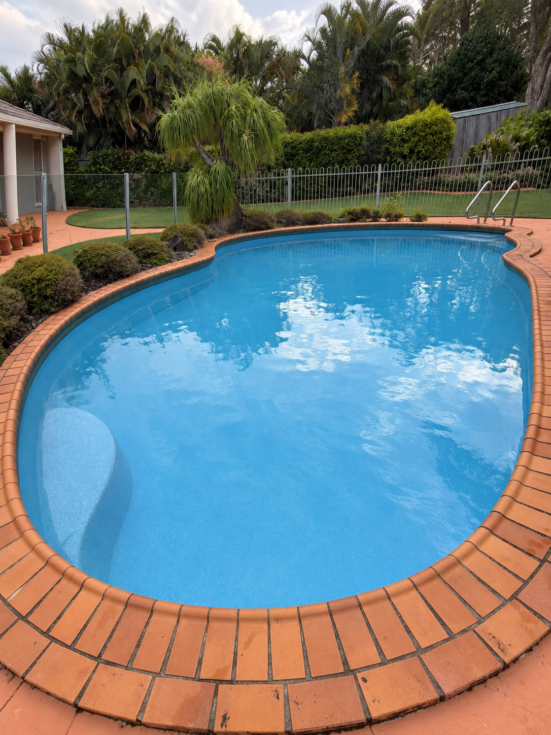 mountain-creek-curved-blue-swimming-pool-clarity-pool-services.png