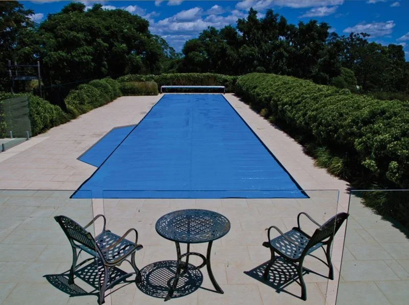 ABGAL solar pool cover fitted to an outdoor swimming pool