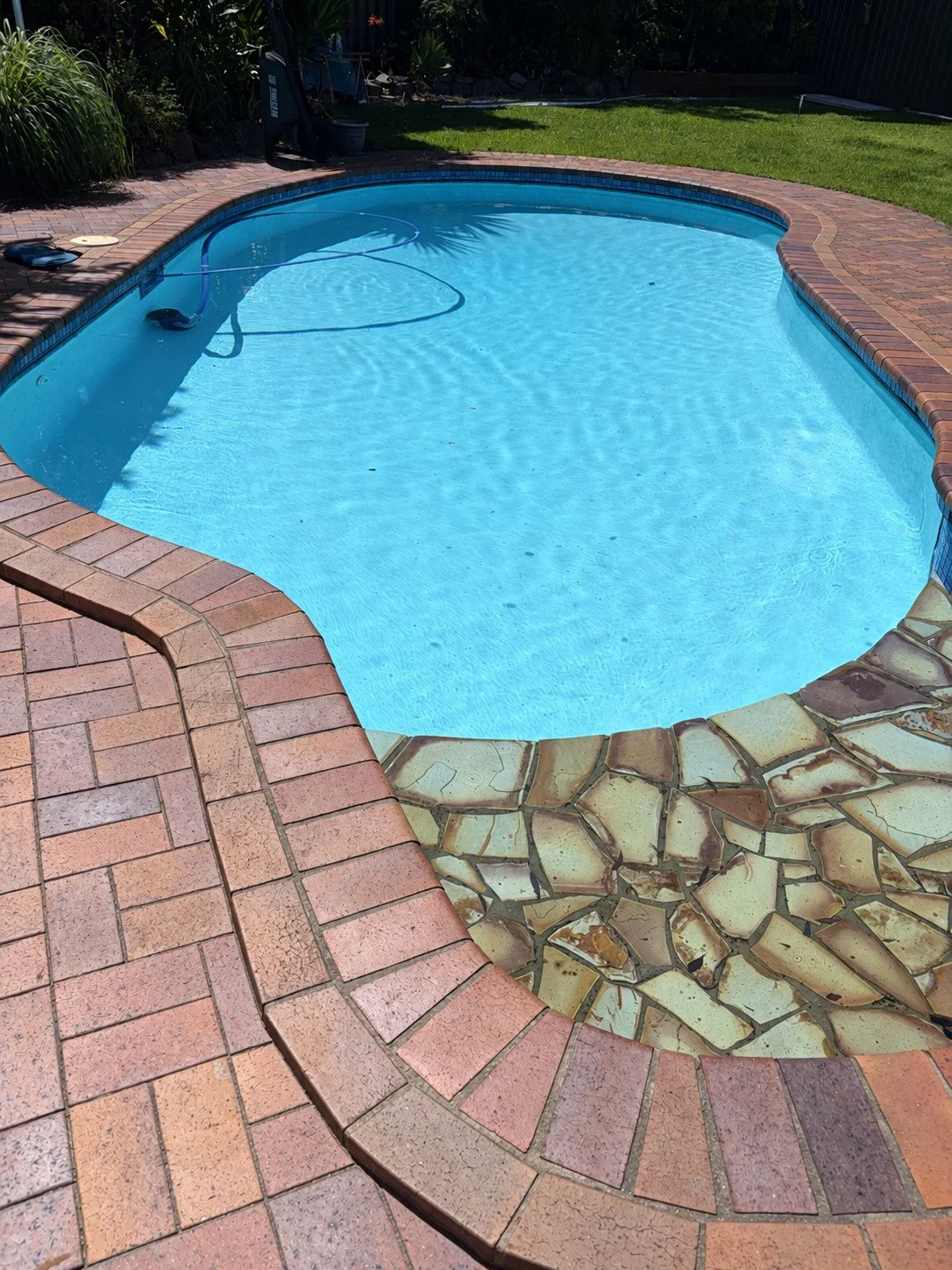 Backyard pool with stone entry in Mountain Creek