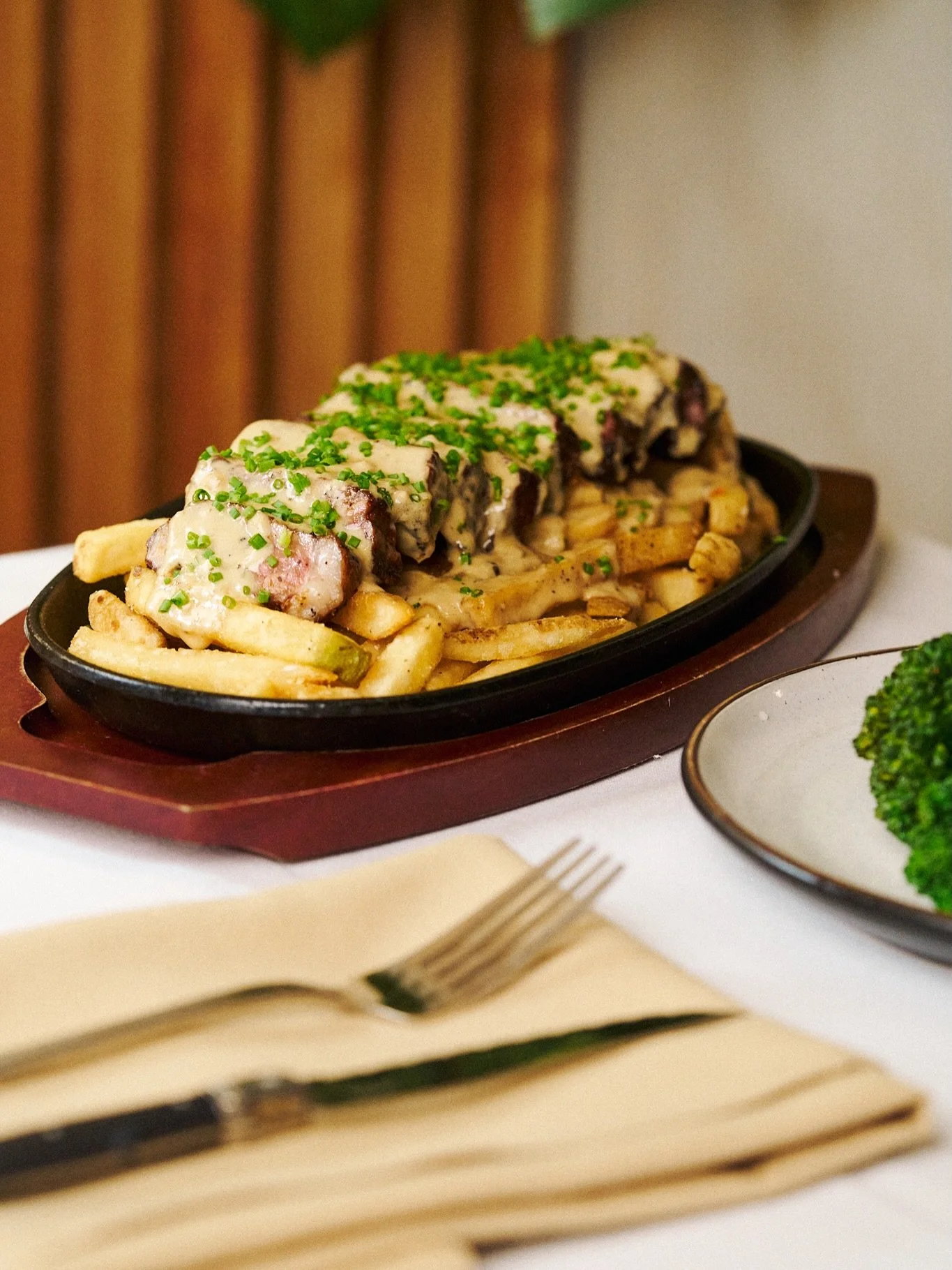 Steak frites, the Pulperia way 🥩✨

New York Strip Sirloin, crispy fries, and a rich green peppercorn sauce,
finished with your choice of side.

Simple, classic, and exactly what you&rsquo;re craving.

#PulperiaNYC #SteakFrites #NYCEats #RestaurantRo