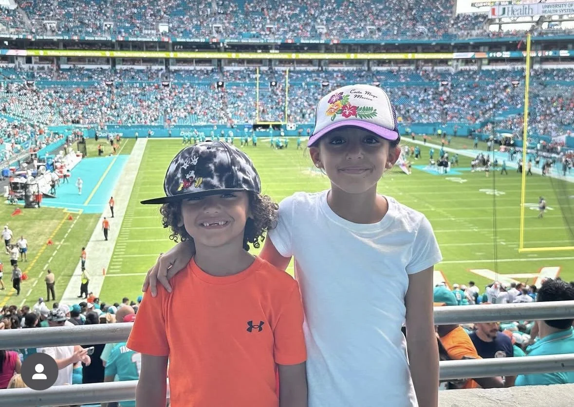 Dylan Strong with Olivia Dolphins game.jpg
