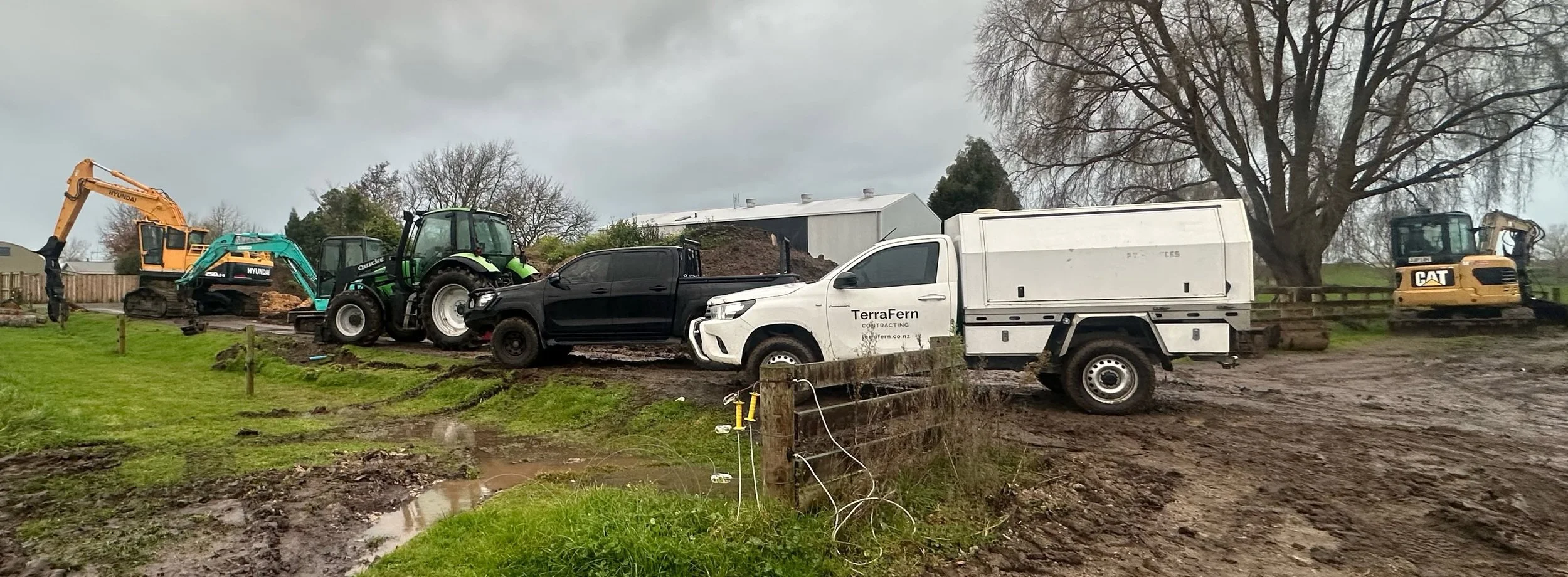 TerraFern Contracting excavators and work vehicles on an earthworks site in Waikato