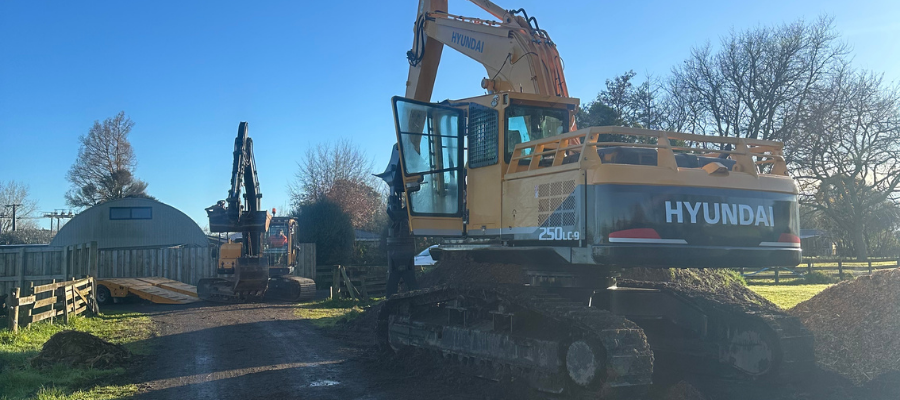 2 Yellow Hyundai excavators on a rural earthworks site in Waikato