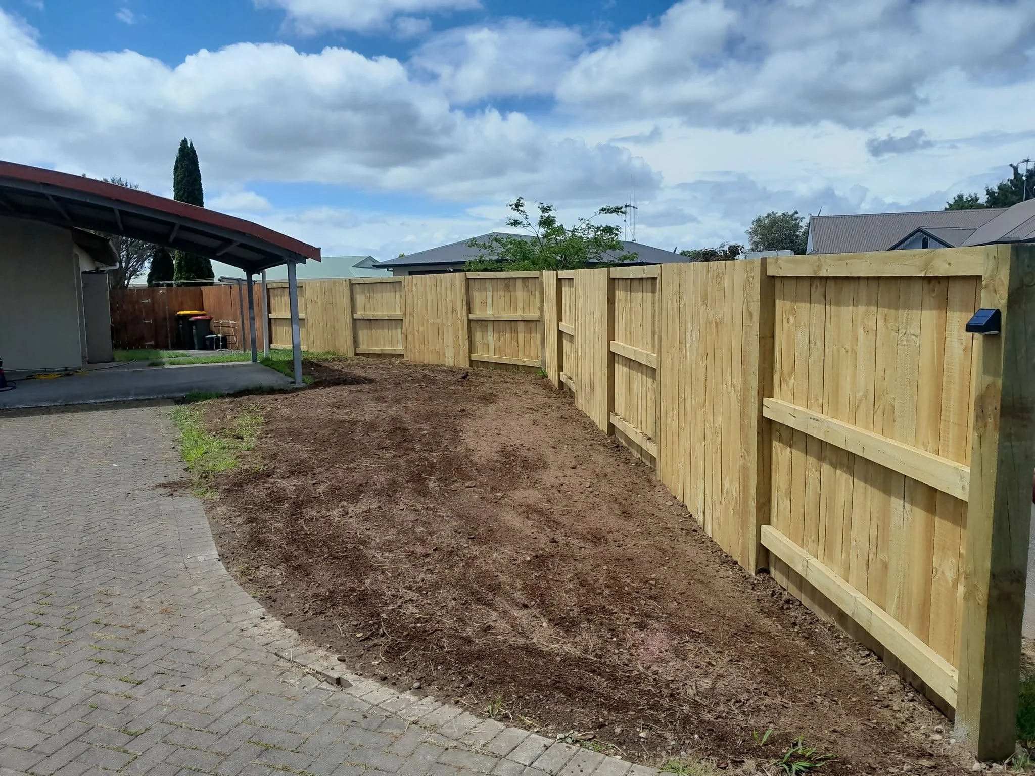 Newly installed wooden backyard fence completed by TerraFern Contracting in Waikato