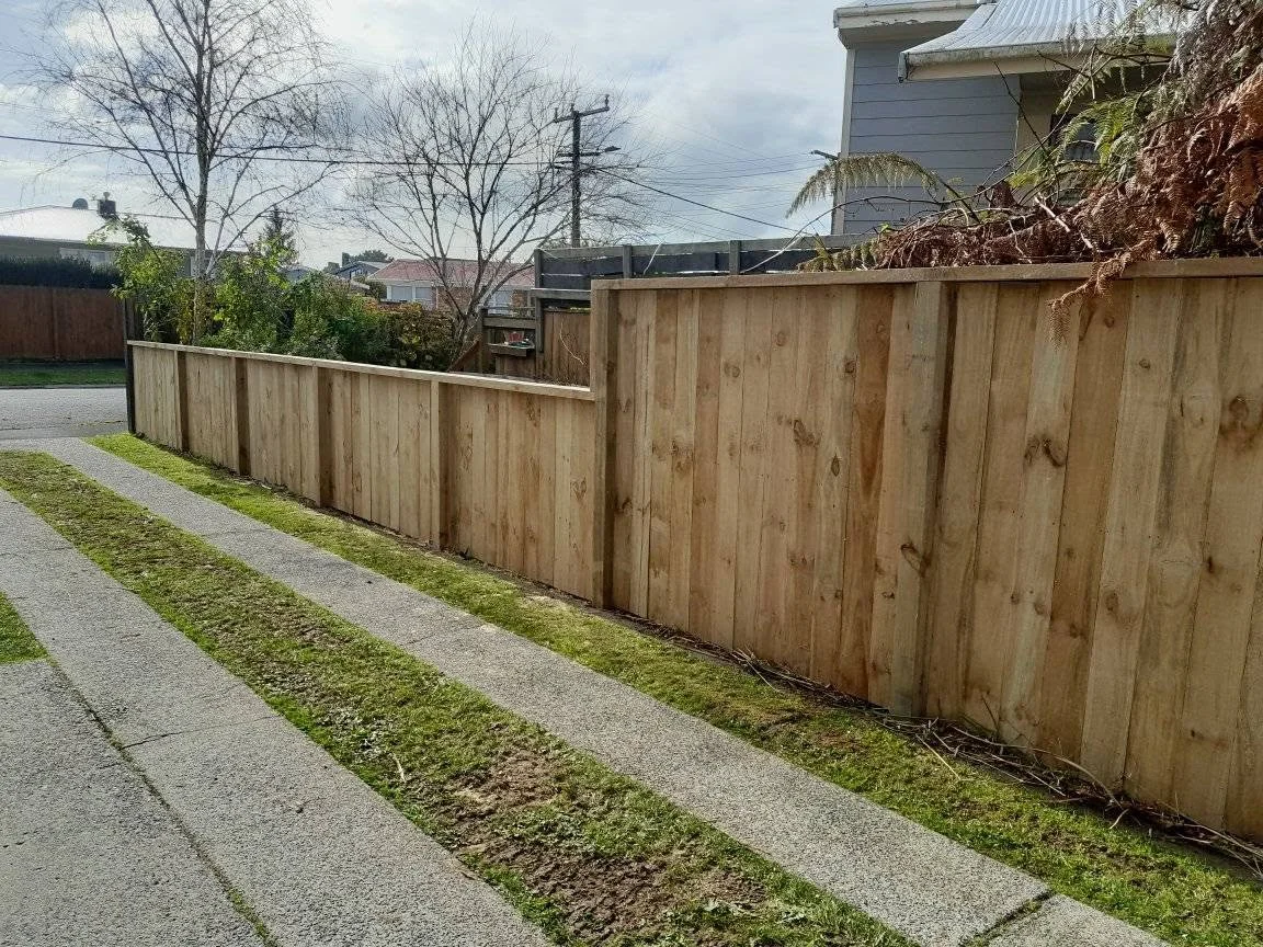 Wooden boundary fence installed beside a footpath on a Waikato property