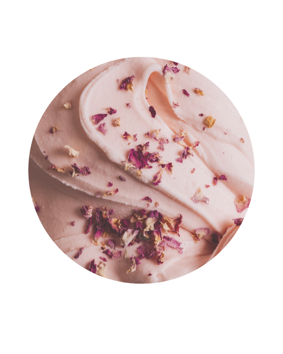 Close-up of pink ice cream with dried rose petals on top.