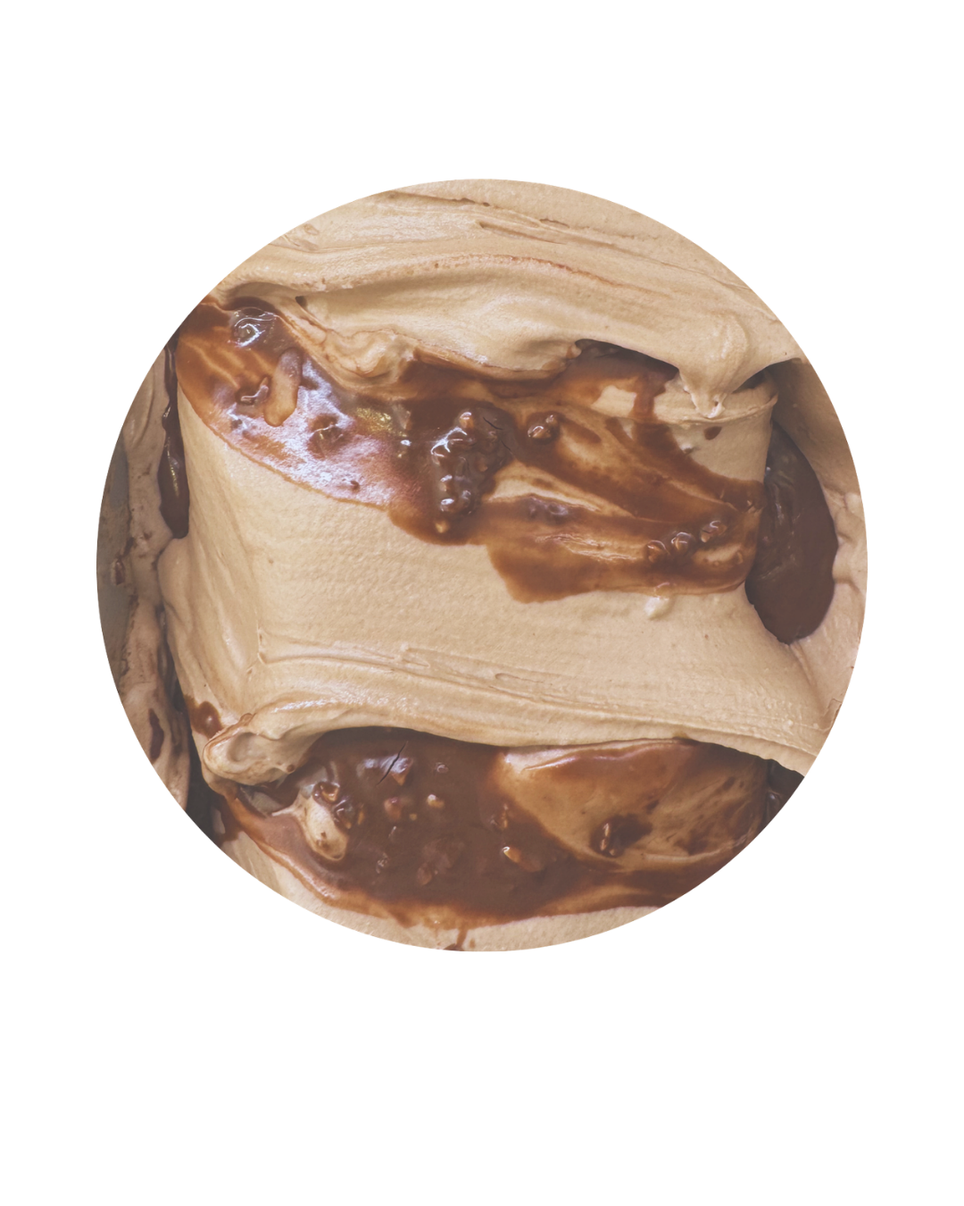 Close-up of a cookie dough ice cream with chocolate swirls and chocolate chips.
