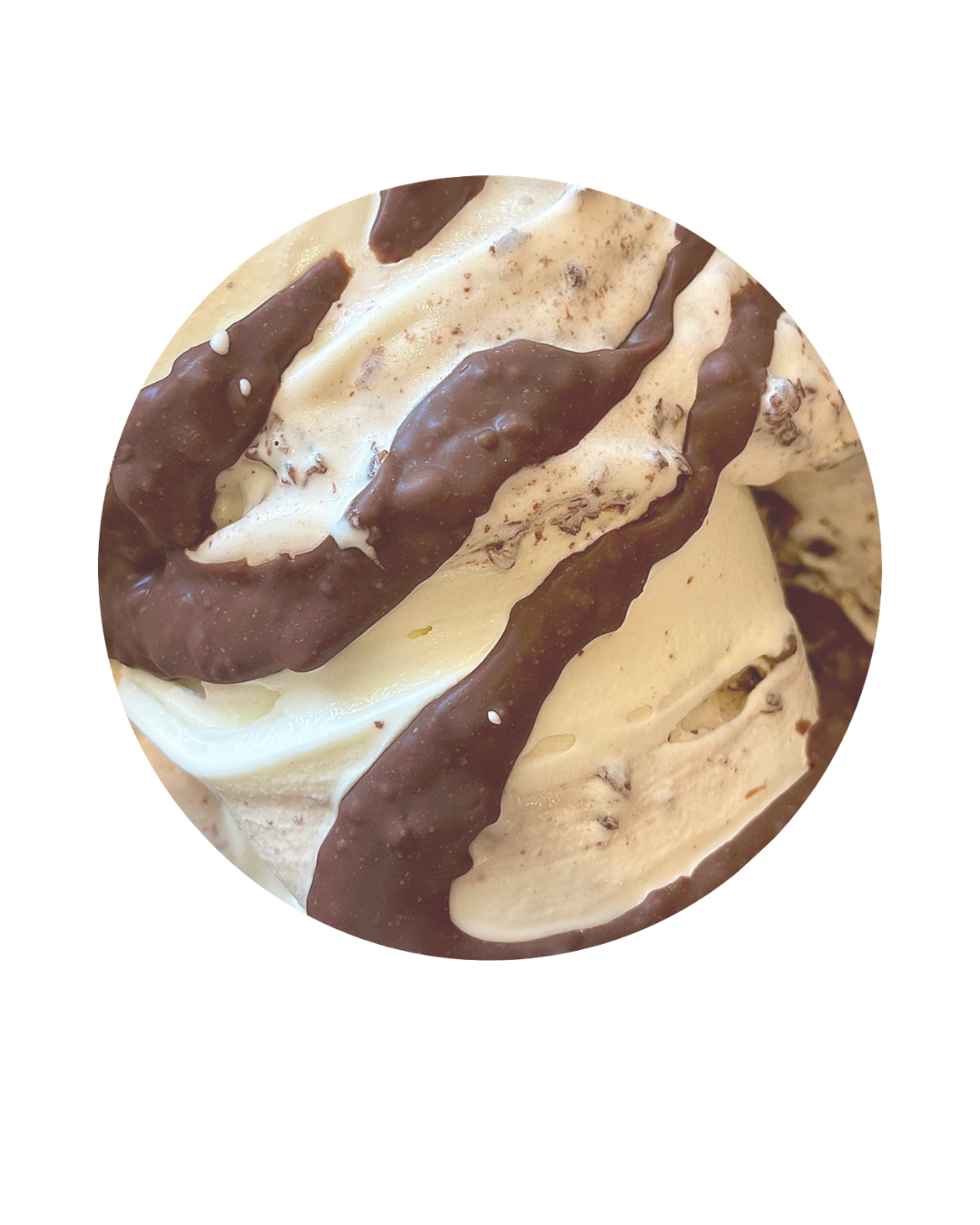 Close-up of a swirl of vanilla and chocolate ice cream with chocolate drizzle.
