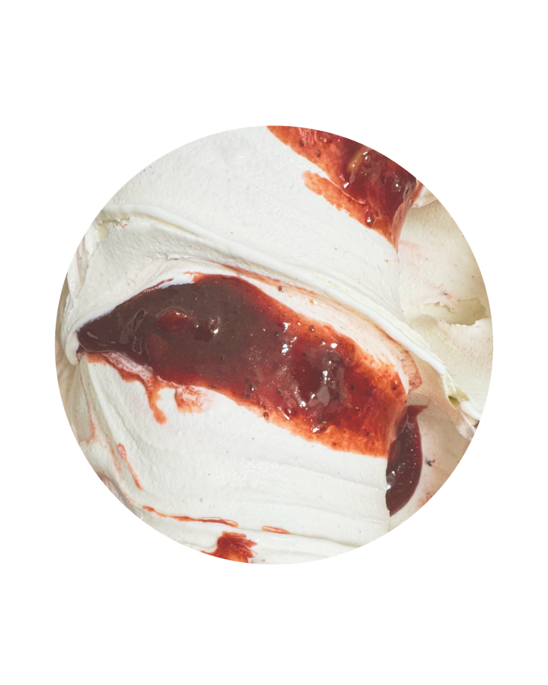 Close-up of a scoop of vanilla ice cream with strawberry topping and strawberry syrup.