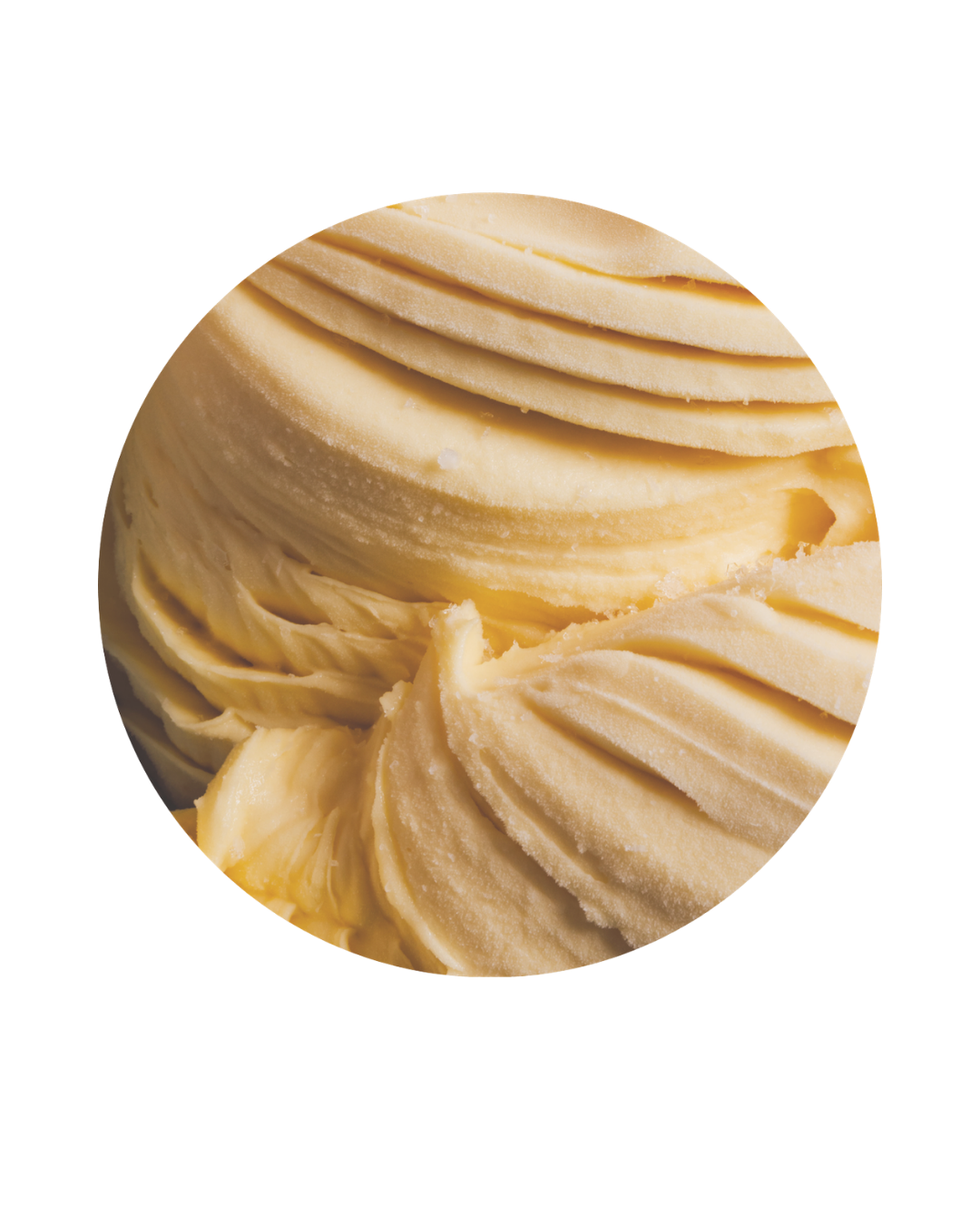 Close-up of a scoop of vanilla ice cream with a smooth surface and ridges.