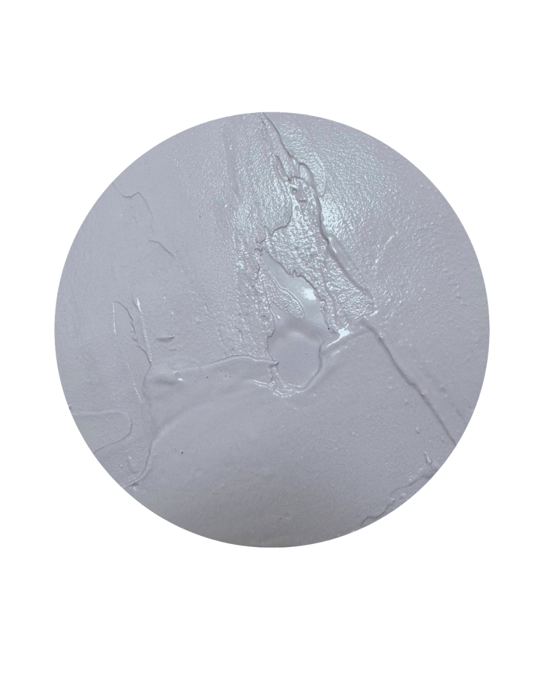 Close-up of a round, gray, cracked cement or concrete surface with visible textured details and cracks.