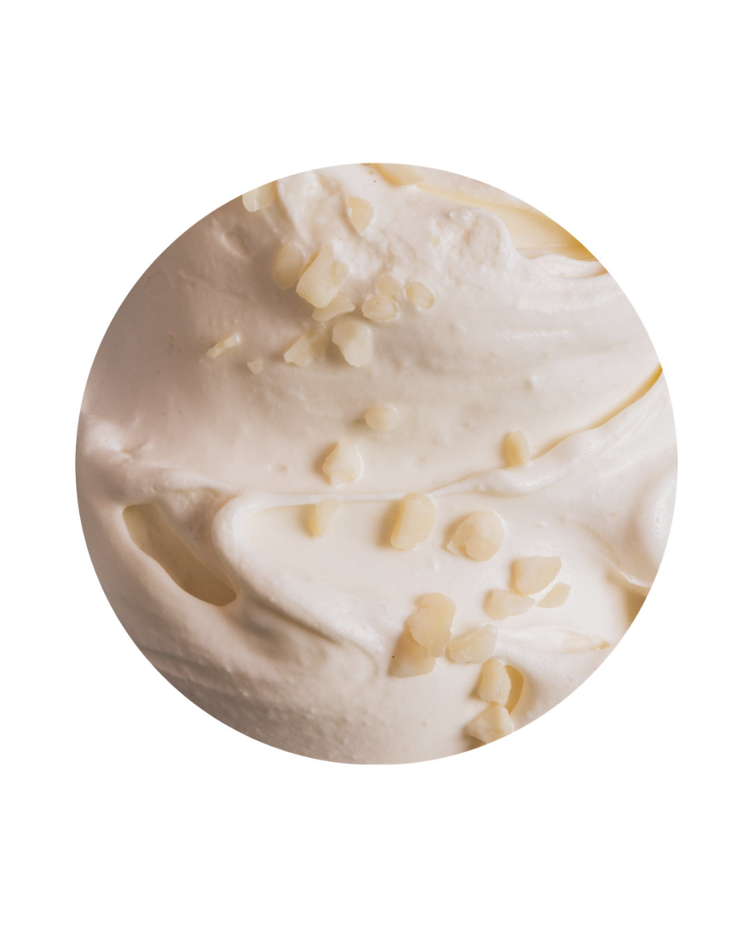 Close-up of a white chocolate ice cream scoop topped with white chocolate shavings.