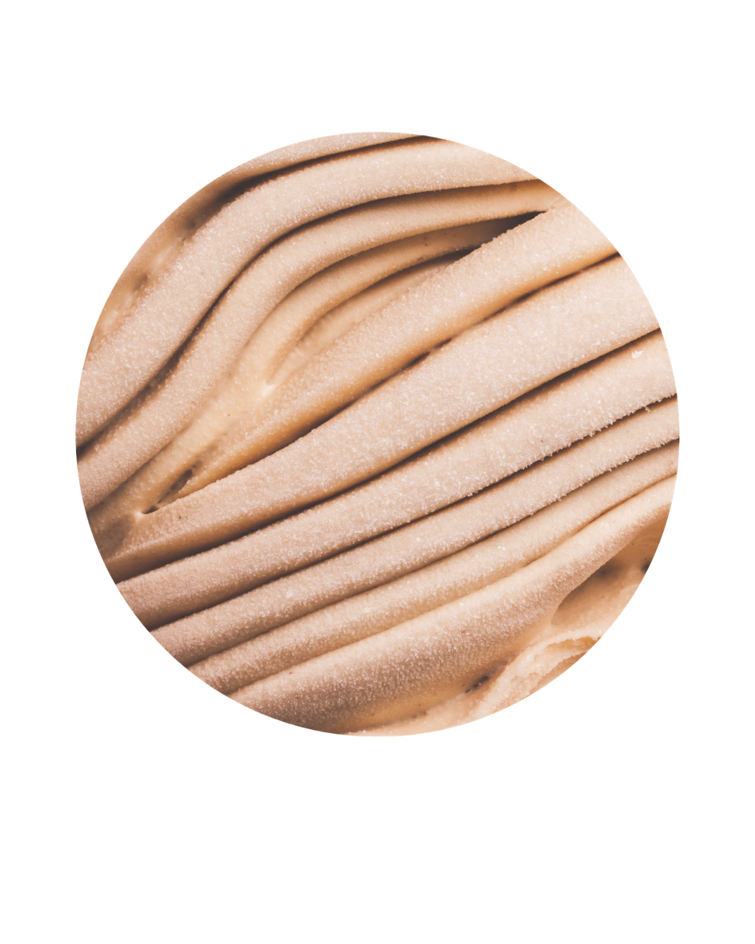 Close-up of a swirl of light brown ice cream with a smooth texture.