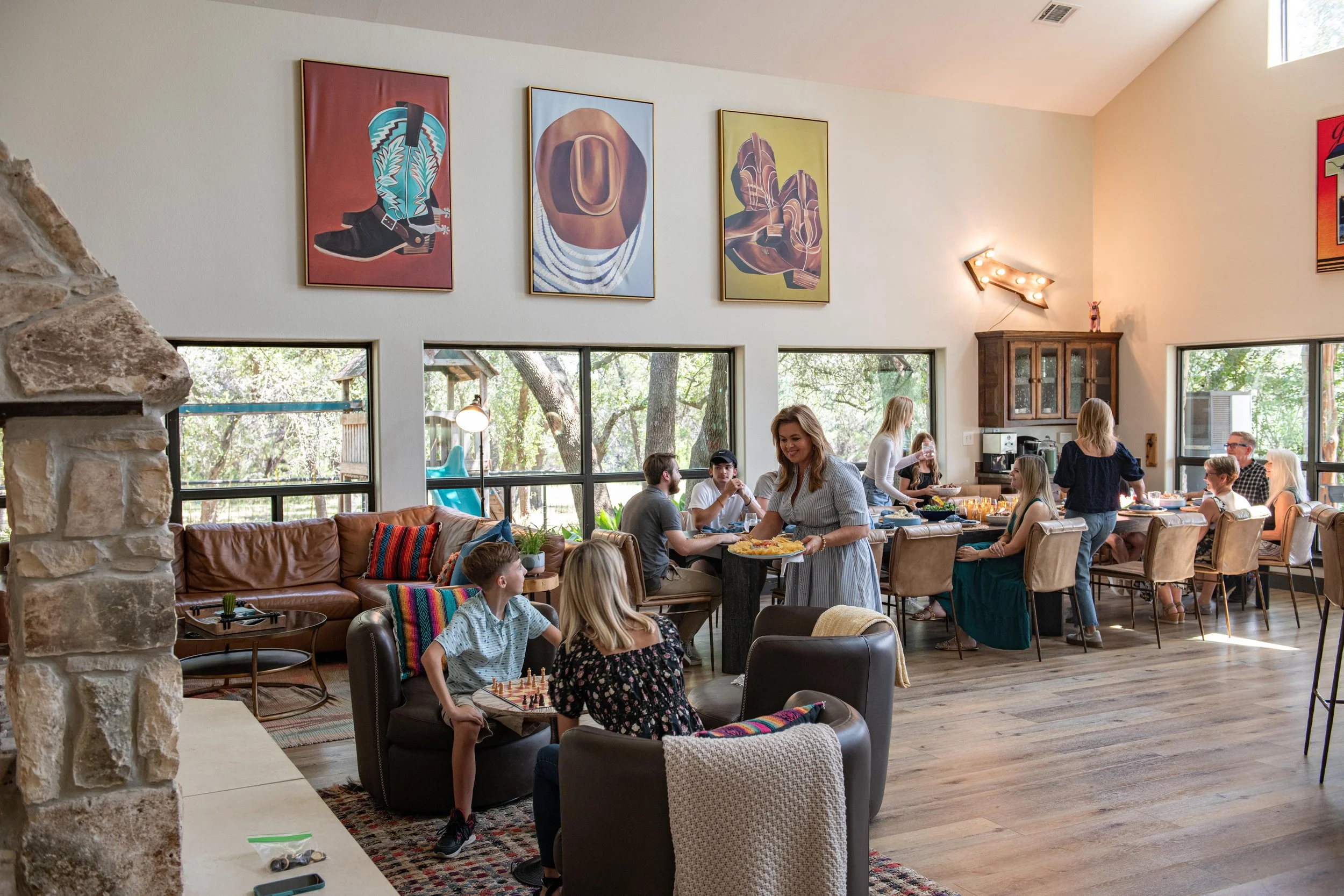 Multigenerational family spending time together in the Main House at The Gathering in Wimberley, Texas.