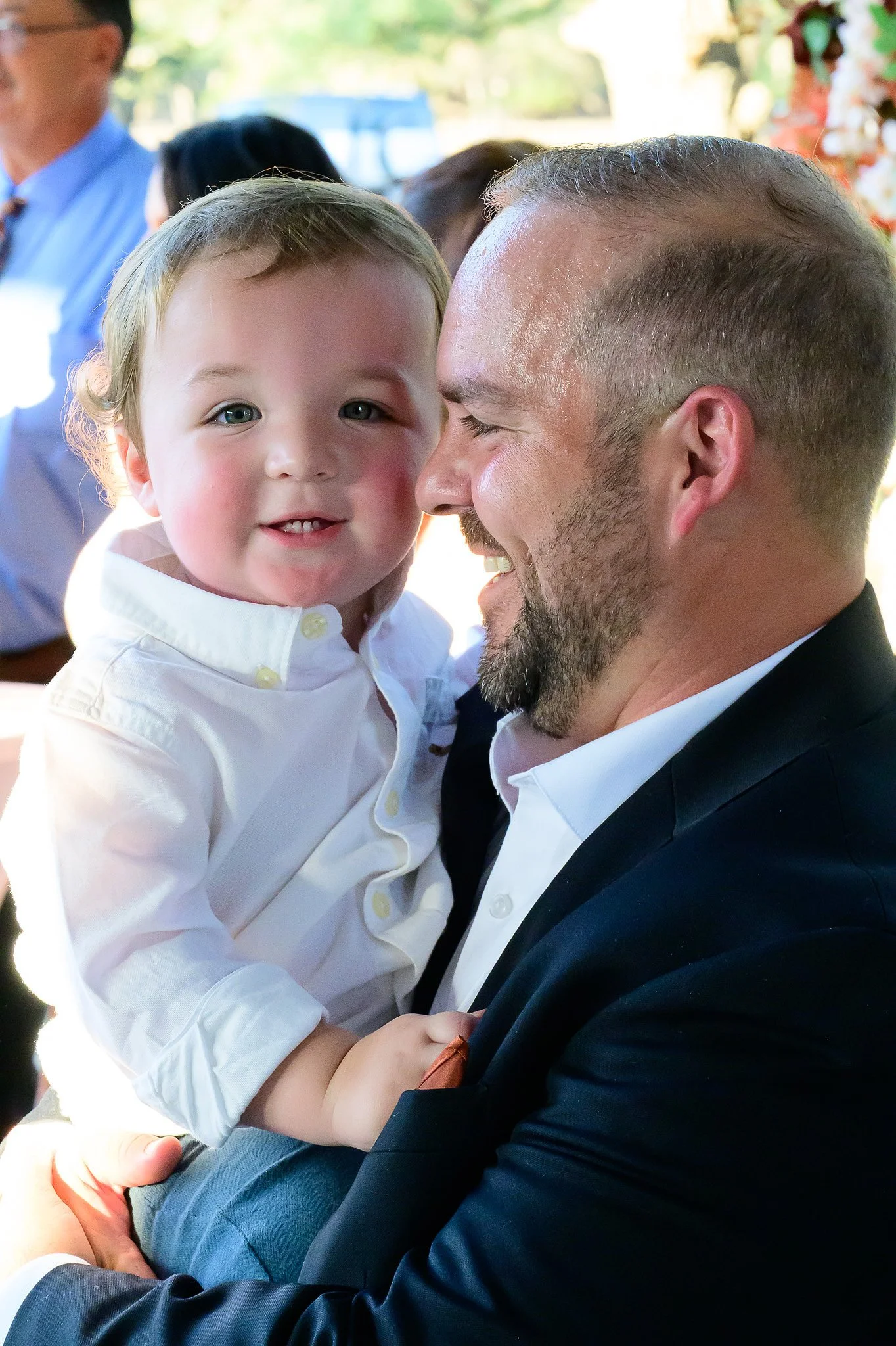 Father holding a baby during a family gathering at The Gathering.