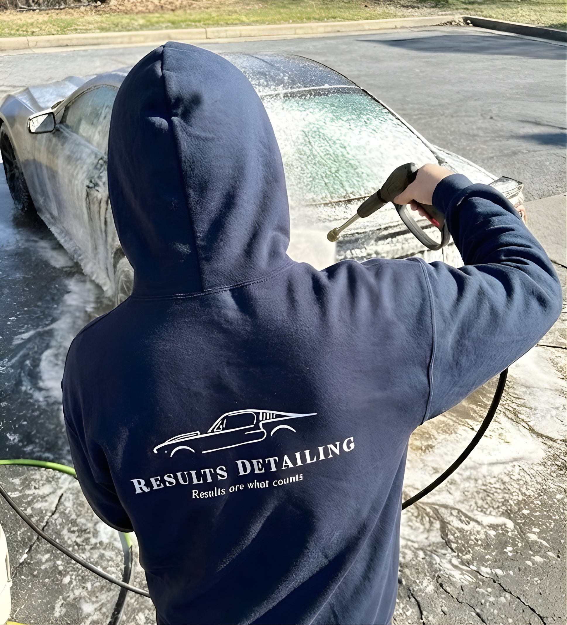 Professional exterior mobile auto detailing by Results Detailing in Ithaca, NY, featuring paint decontamination and hand washing for a high-gloss finish.