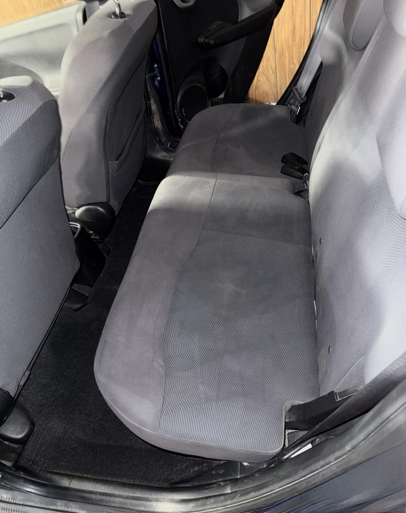 Clean and refreshed cloth backseats in a Honda Fit after professional extraction and interior detailing by Results Detailing and Pressure Washing in Ithaca, NY.