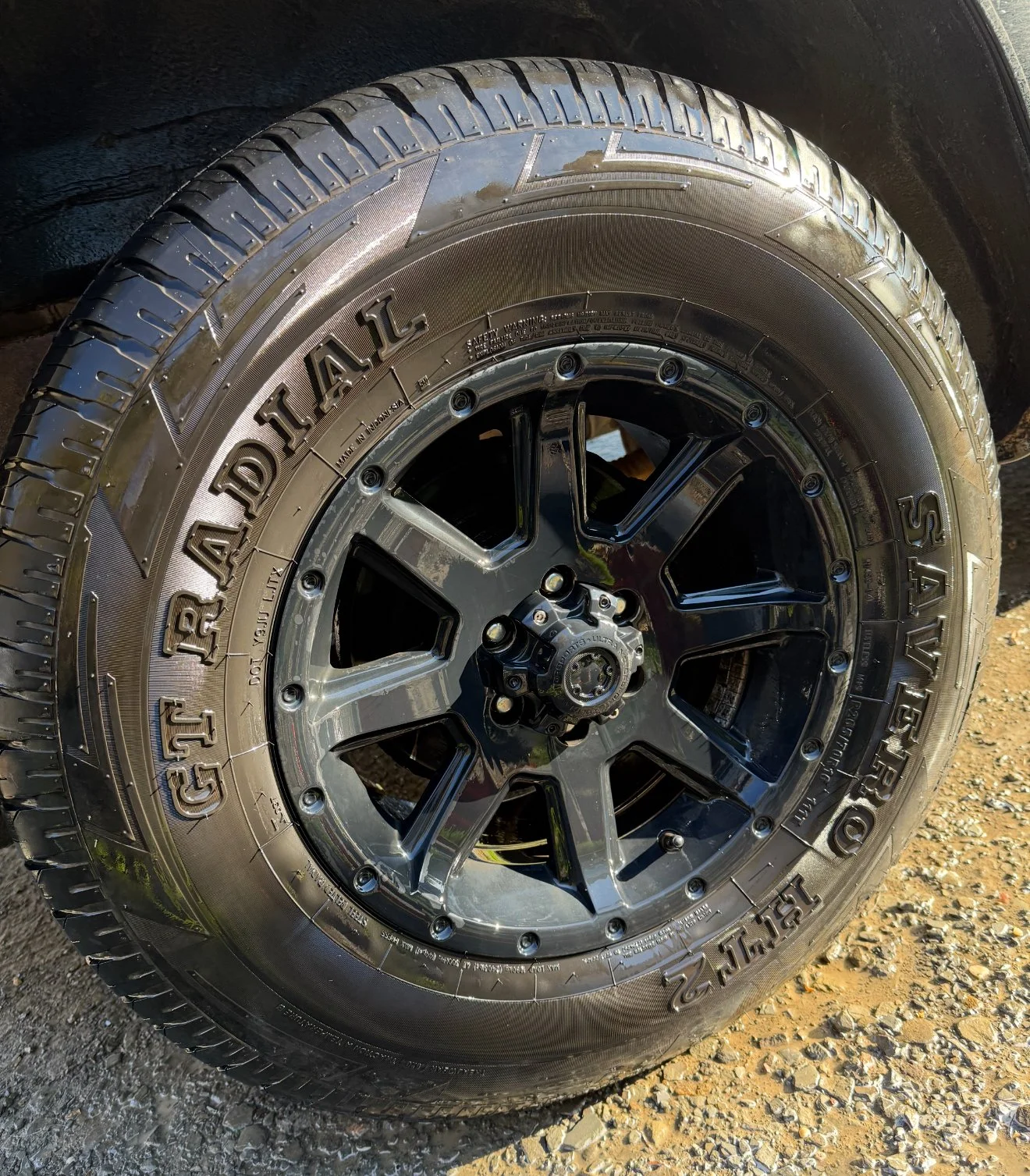 Close up of a deep-cleaned vehicle rim and conditioned tire by Results Detailing and Pressure Washing in Trumansburg, NY.