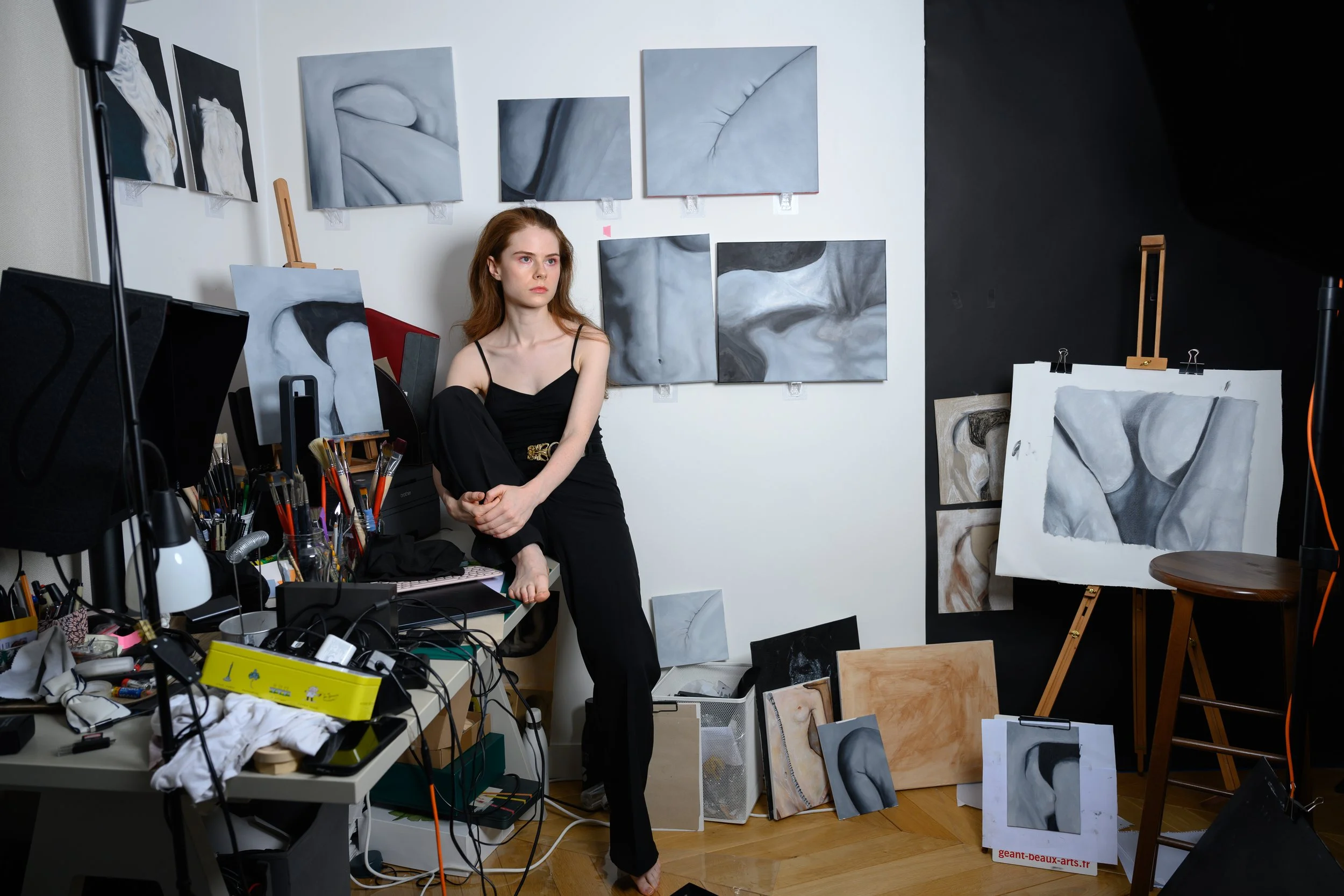 studio atelier portrait of artist with her oil paintings