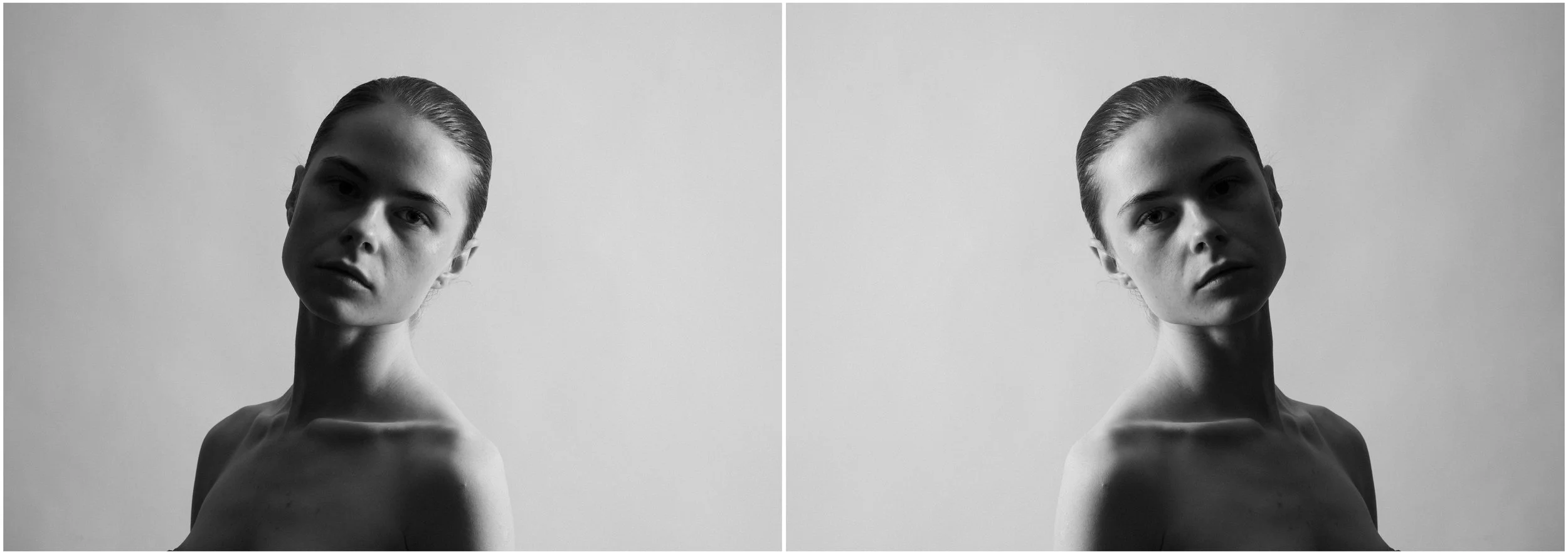 A black and white mirror-reflection portrait of a young woman. She is looking straight into the camera, her head slightly inclined. Very strong shadows and contrasts.