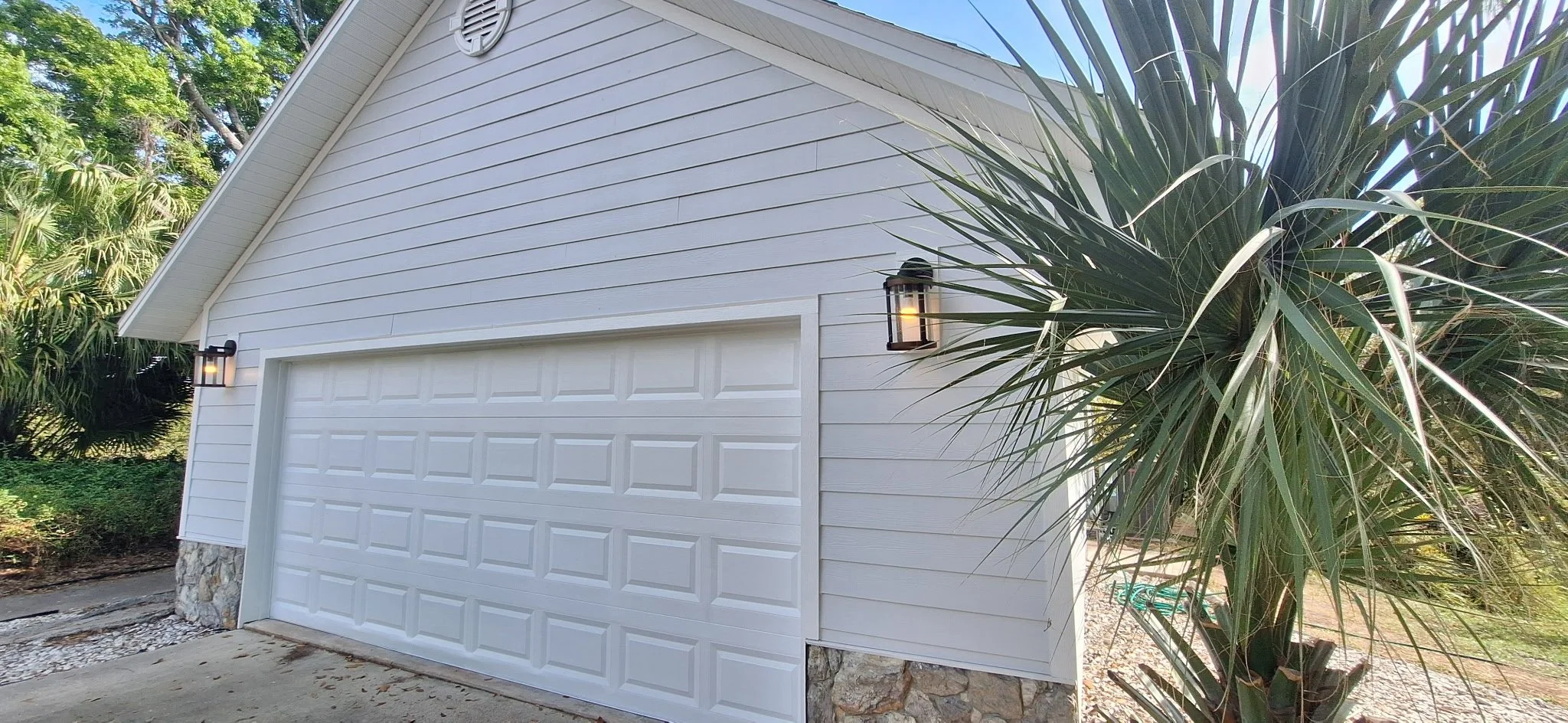 Freshly painted white garage exterior in Melbourne Florida with modern clean finish.