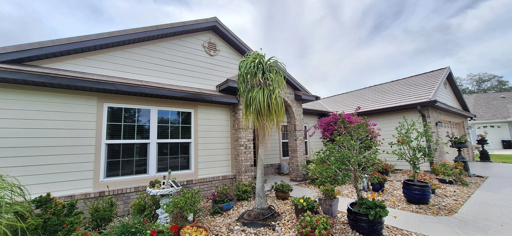 curb appeal Melbourne Florida home exterior painting with brick and landscaping