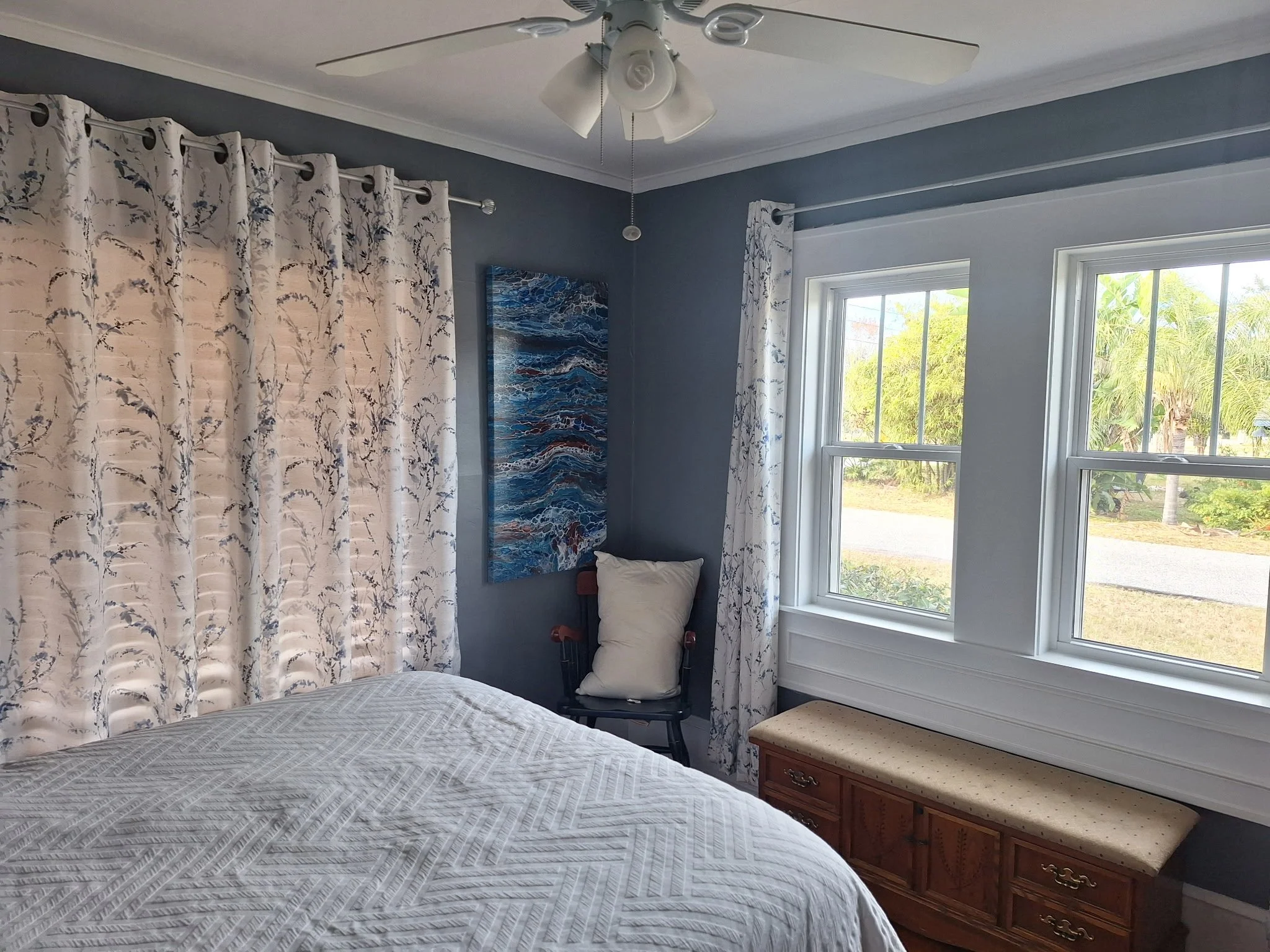 Bedroom interior painting in East Colonial Orlando with calming blue-toned walls
